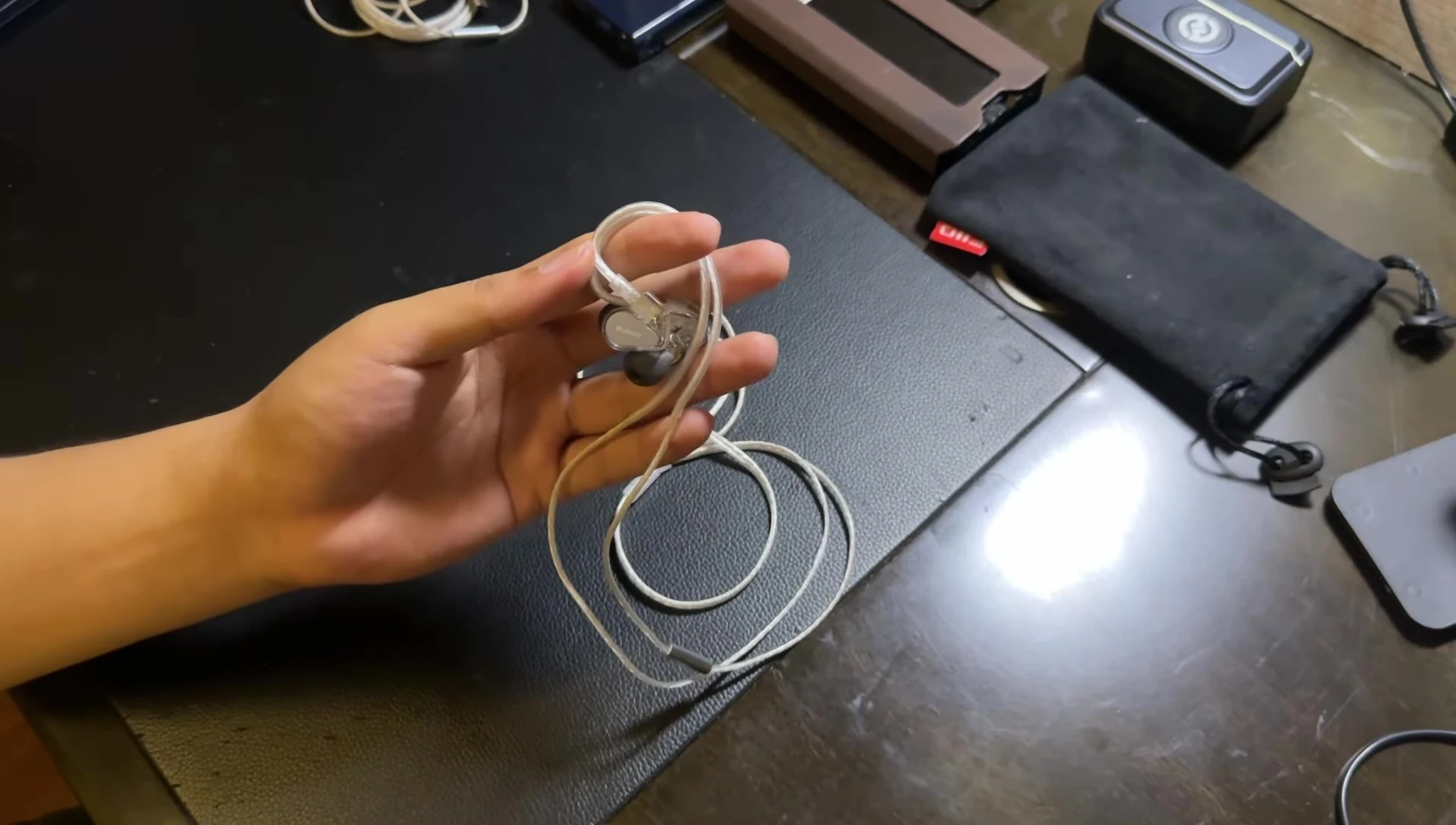 Earbuds connected to the source