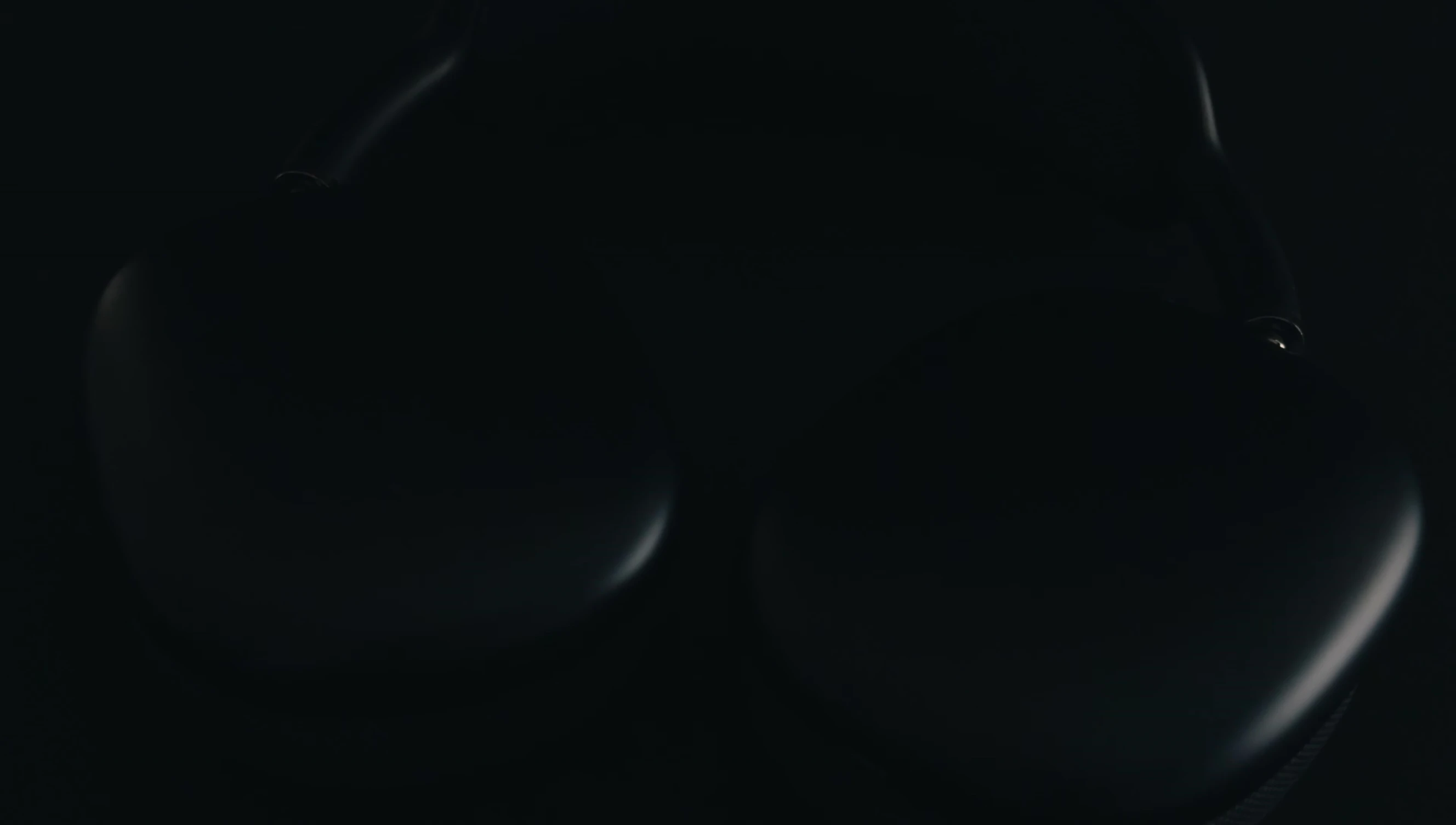 Close-up of AirPods Max showcasing the midnight color