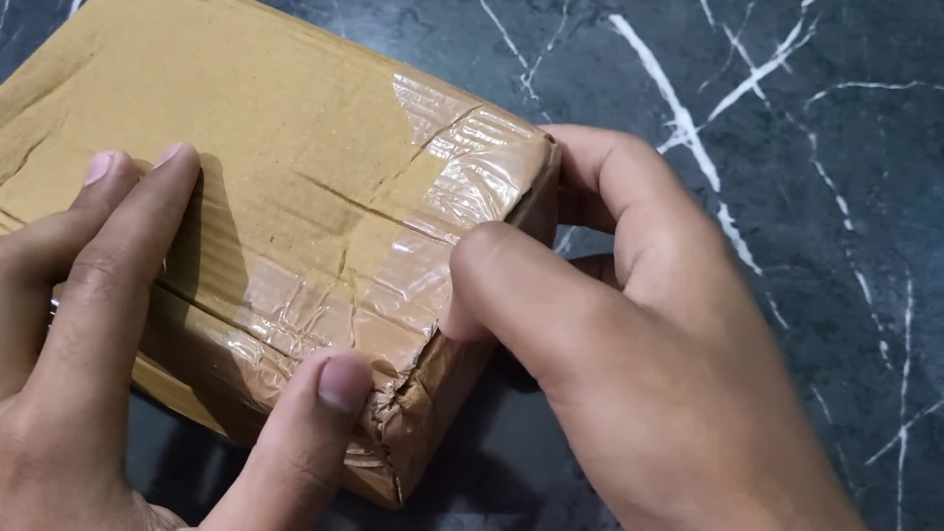 Opening the minimalist packaging of the P47 headphones.