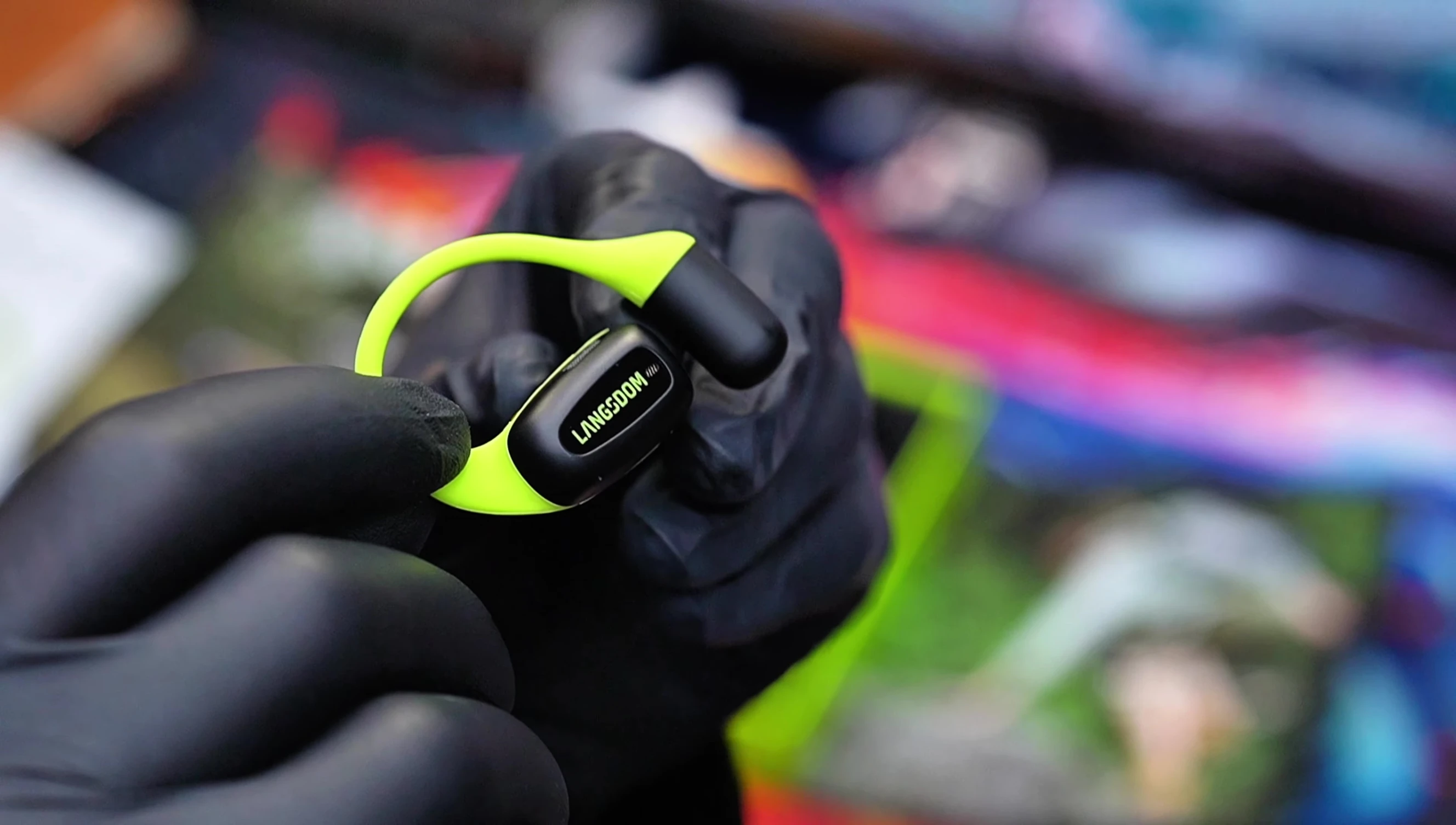 Person exercising outdoors while wearing the earbuds.