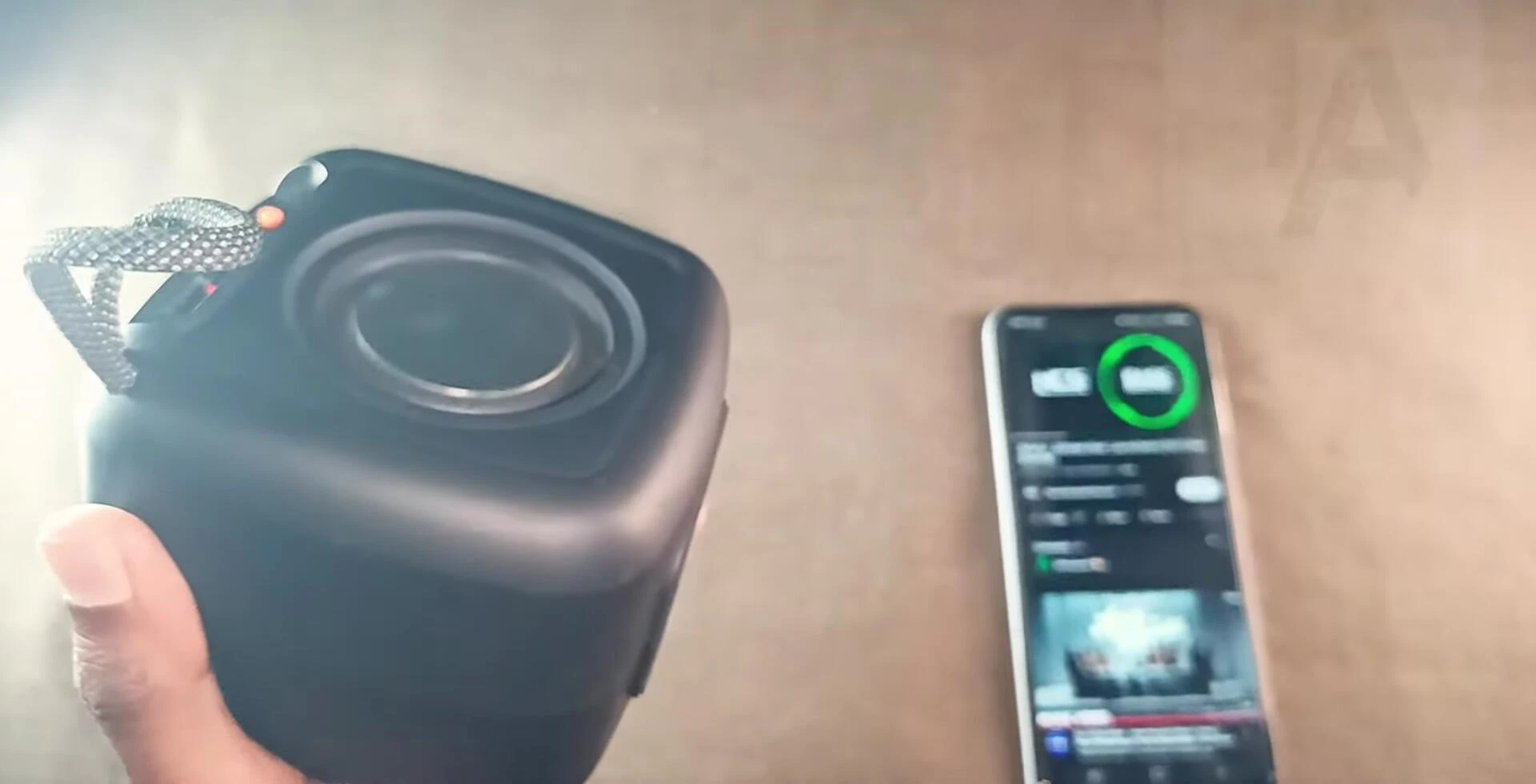 Speaker playing music, showcasing sound quality.