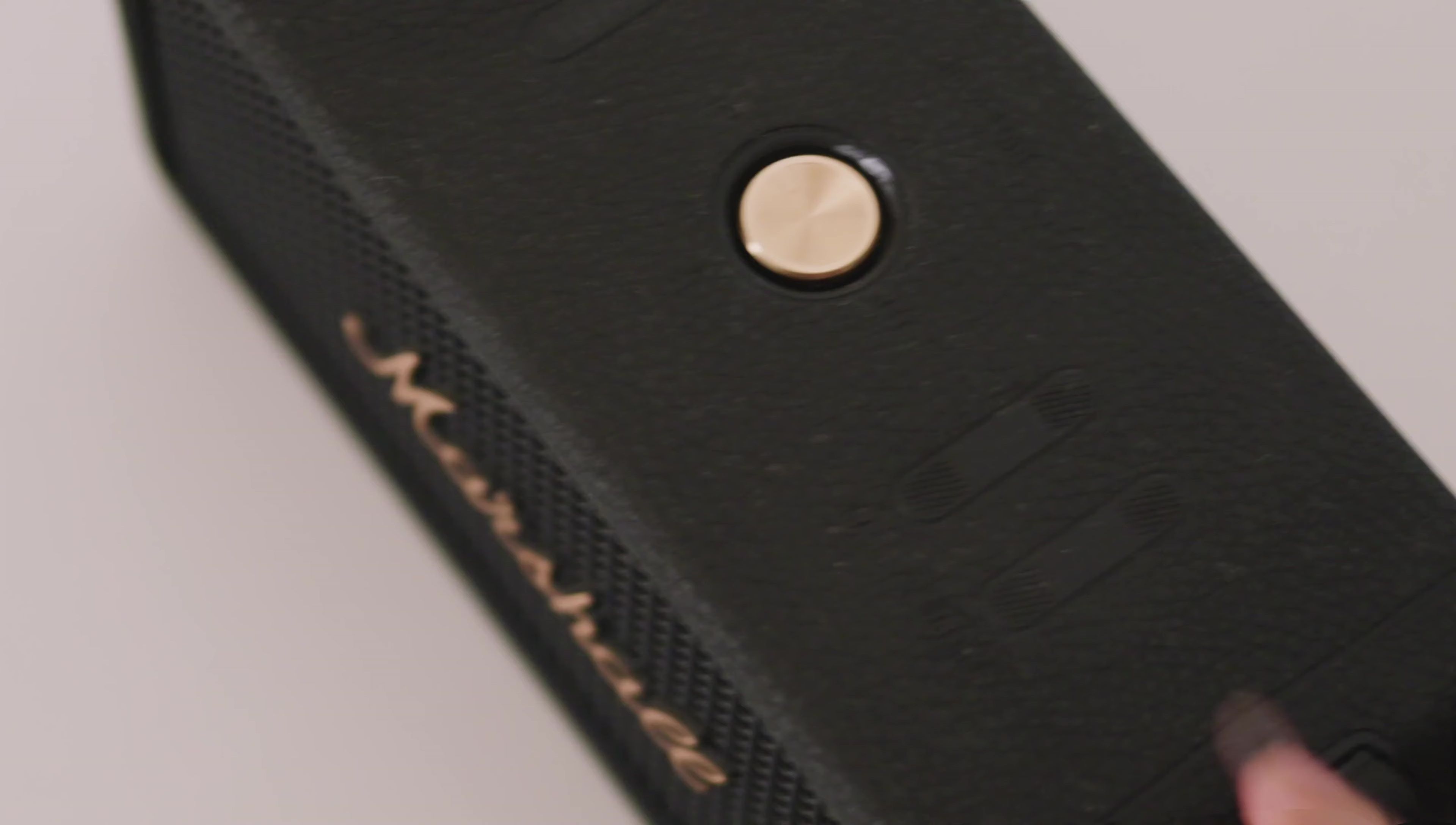 Close-up of the speaker's grill, emphasizing the sound quality.