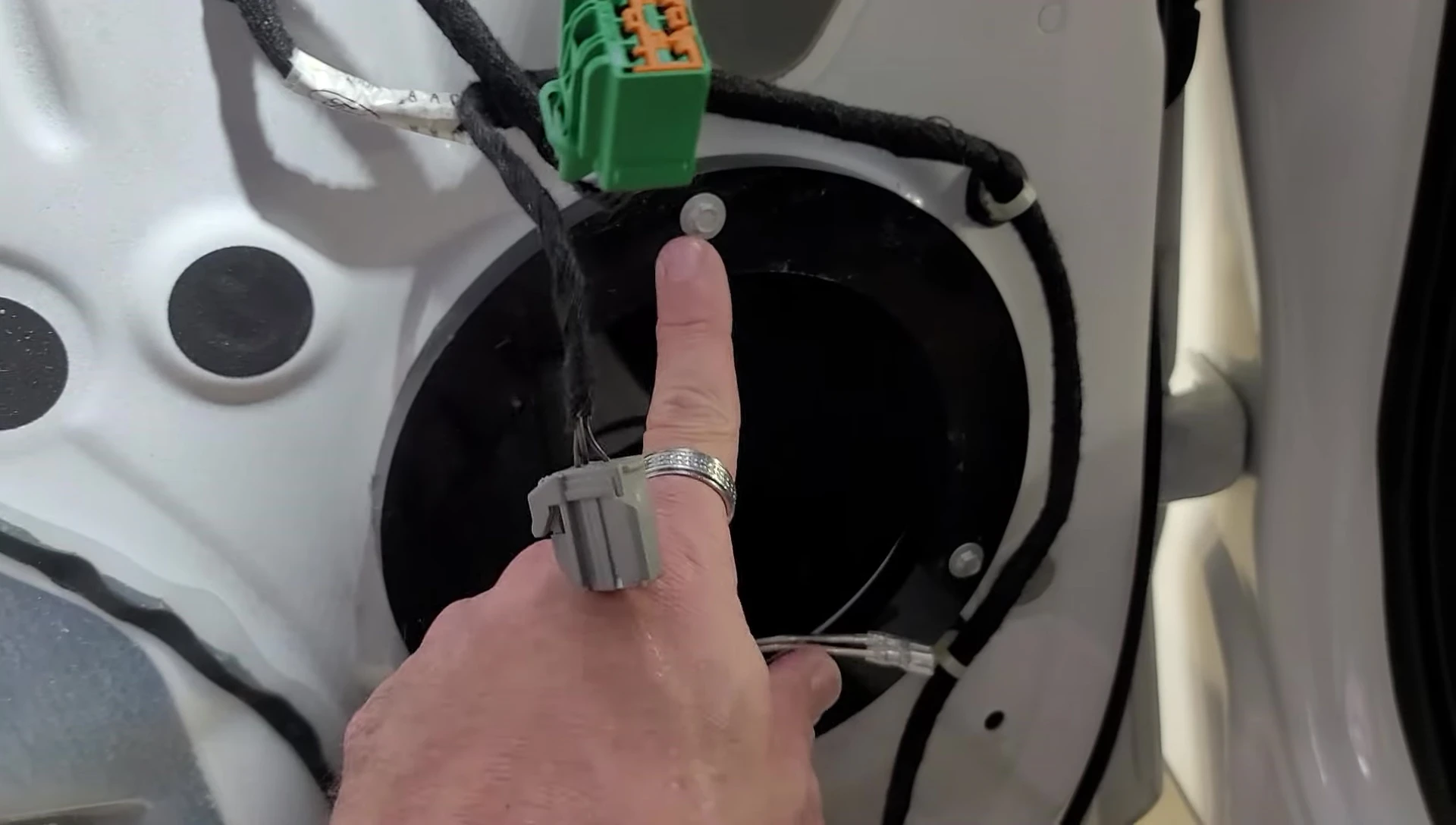 The speaker being mounted using the custom adapter plate
