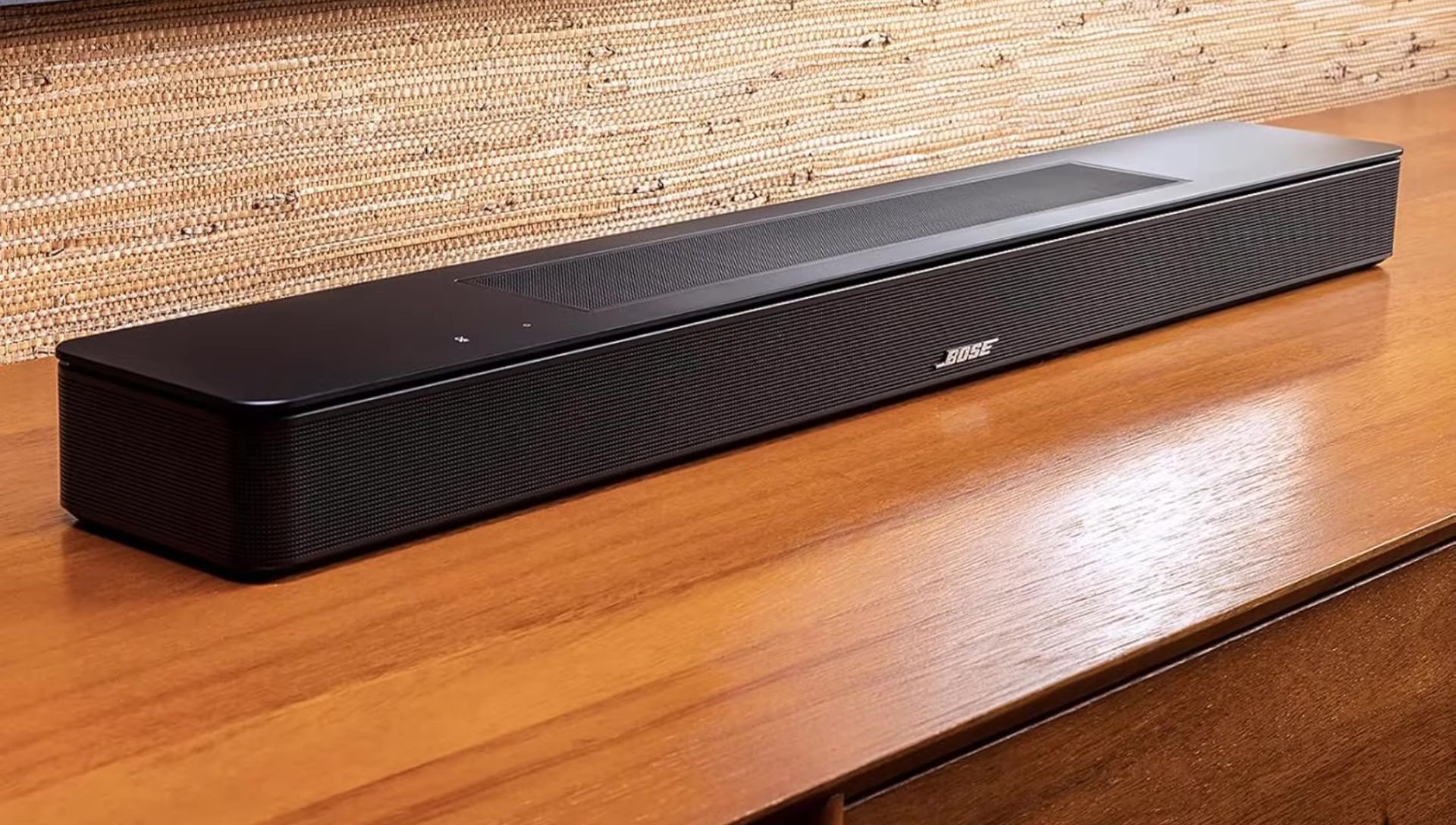 Image showing the Bose Ultra Open Earbuds connected to the soundbar