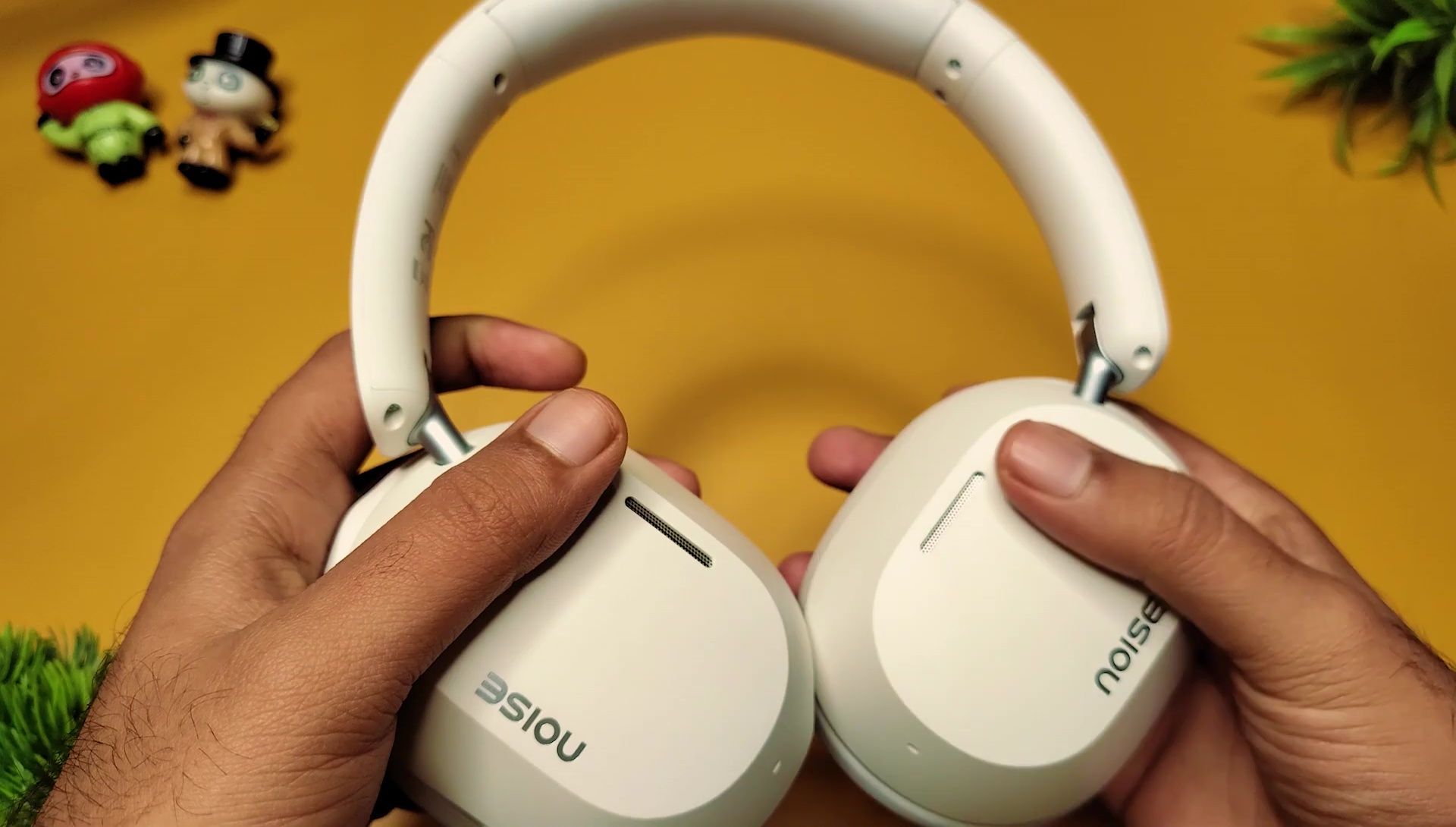 Image showcasing the Noise Airwave Max 5 headphones being used