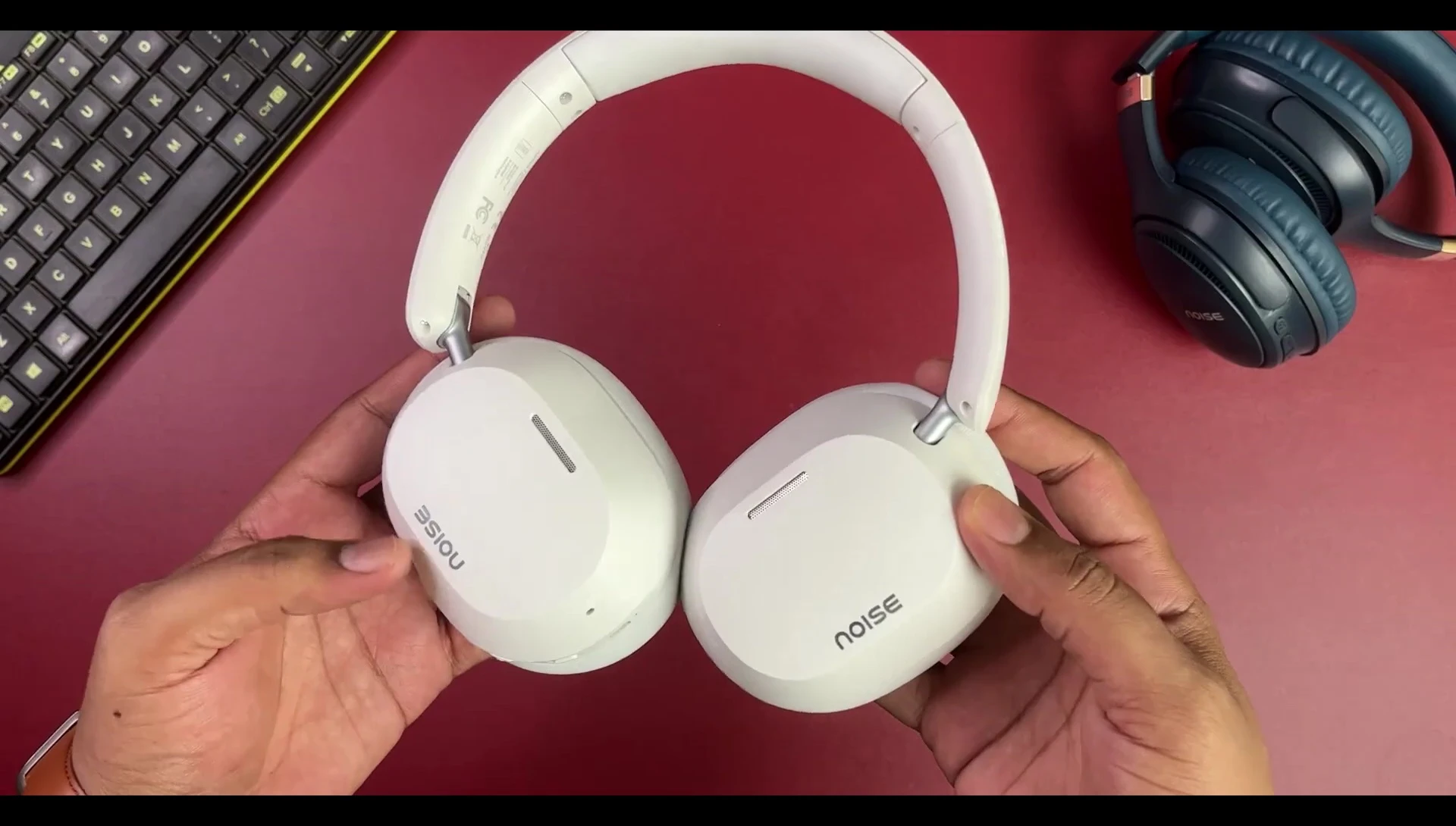 Close-up of the headphones highlighting the plastic material and matte finish.