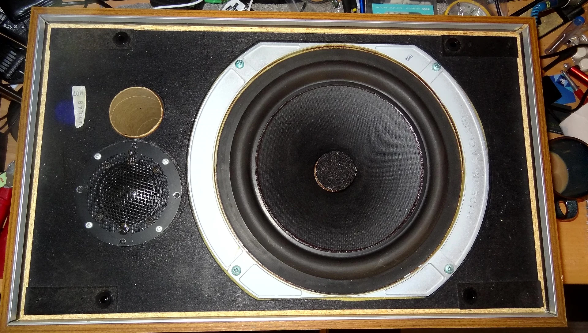 Internal components of the speaker, showcasing the woofer and crossover.