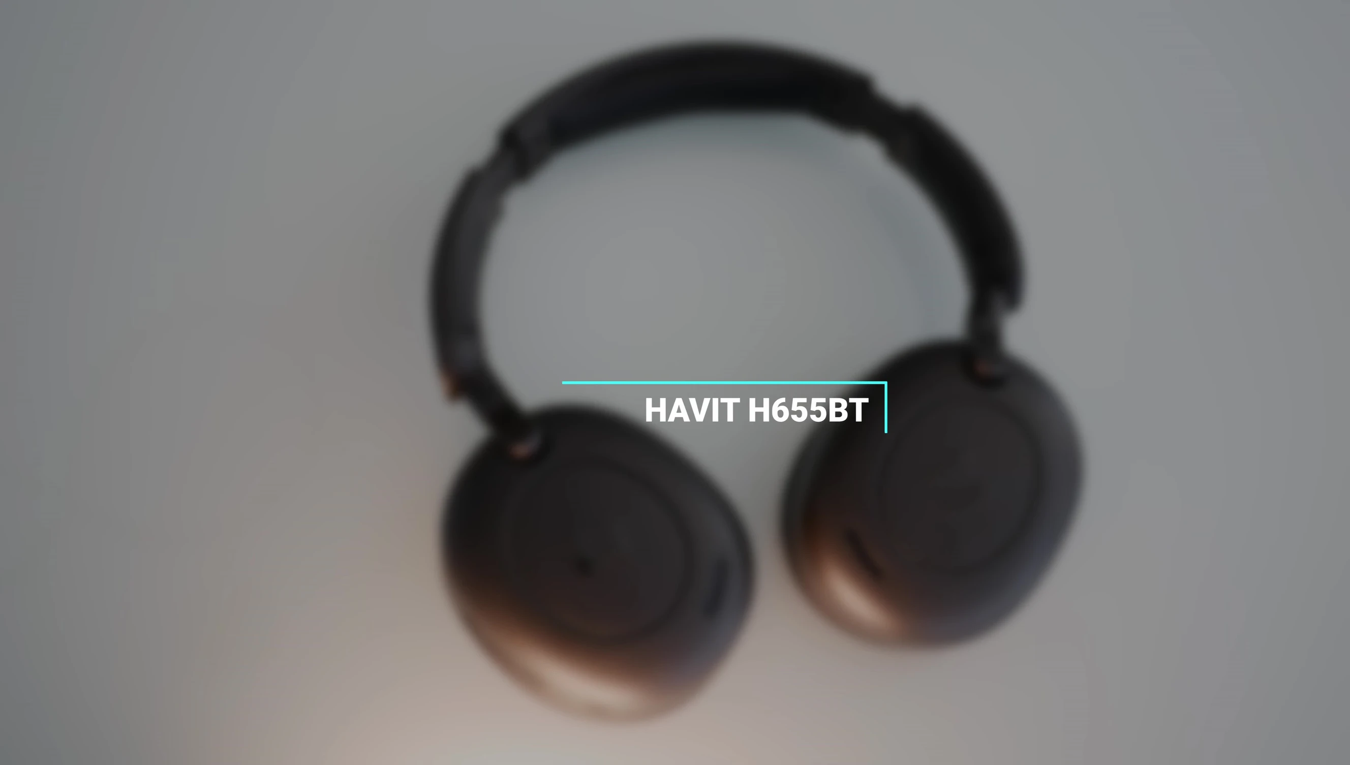 Close-up of the HAVIT H655BT headset showing its plastic construction.