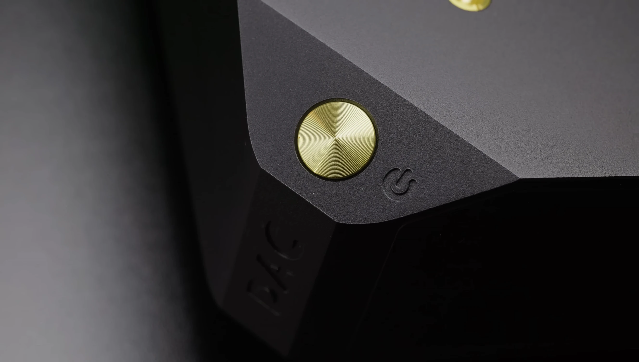 Image showcasing the matte black finish and gold trimming
