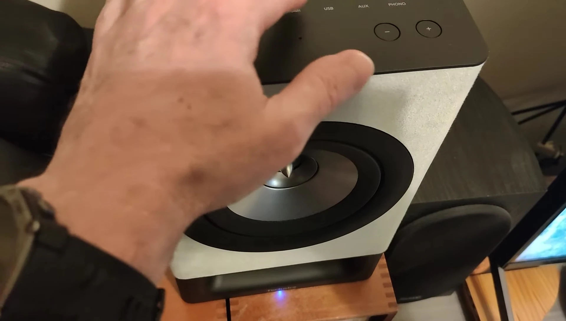 Close-up shot of the top panel showing touch controls.