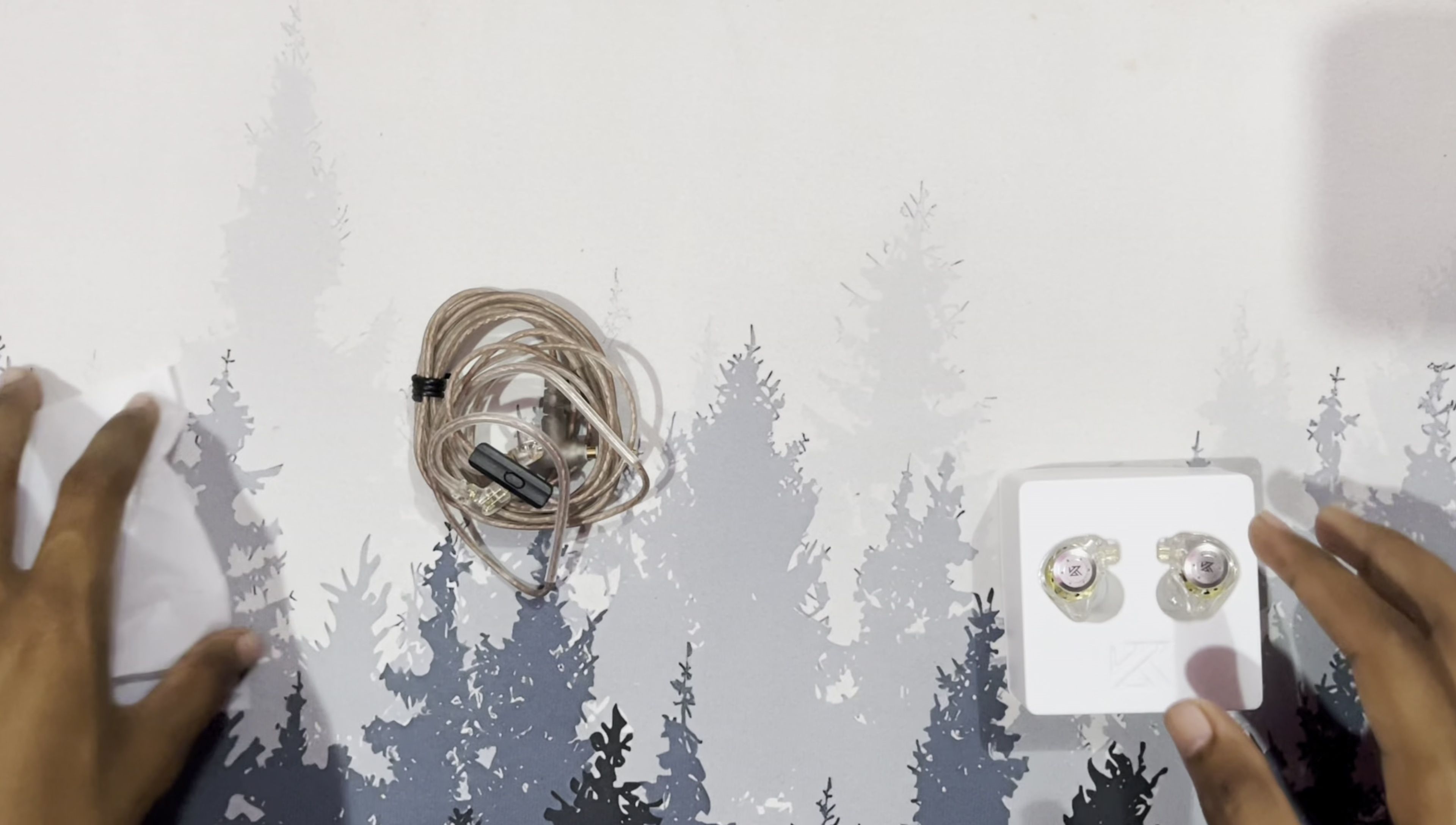 Connecting the cable to the earbuds