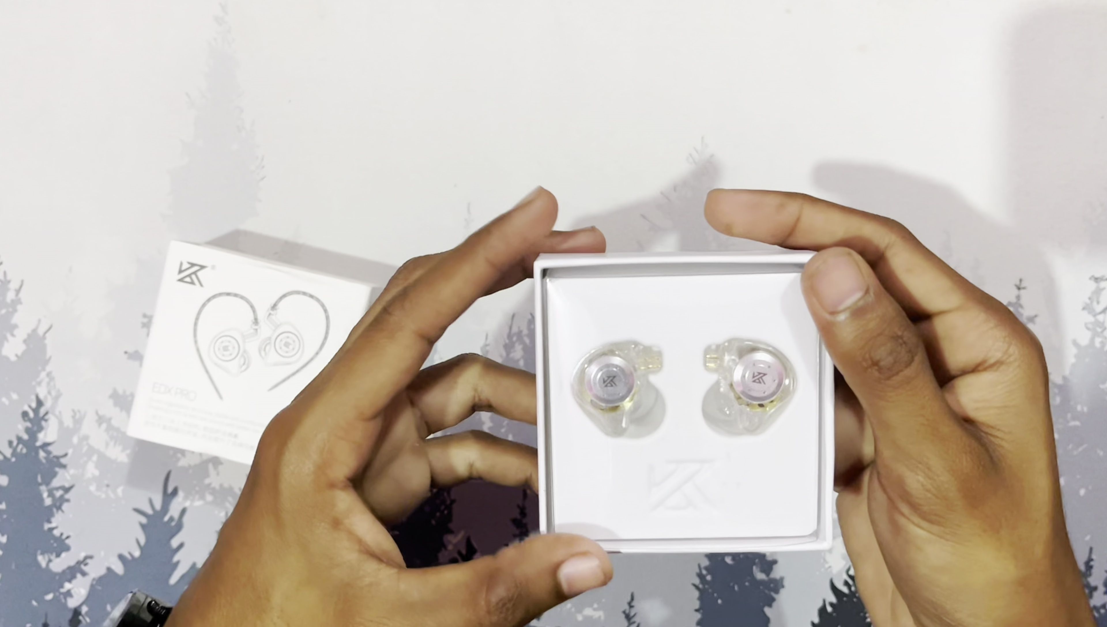 The earphones inside the packaging