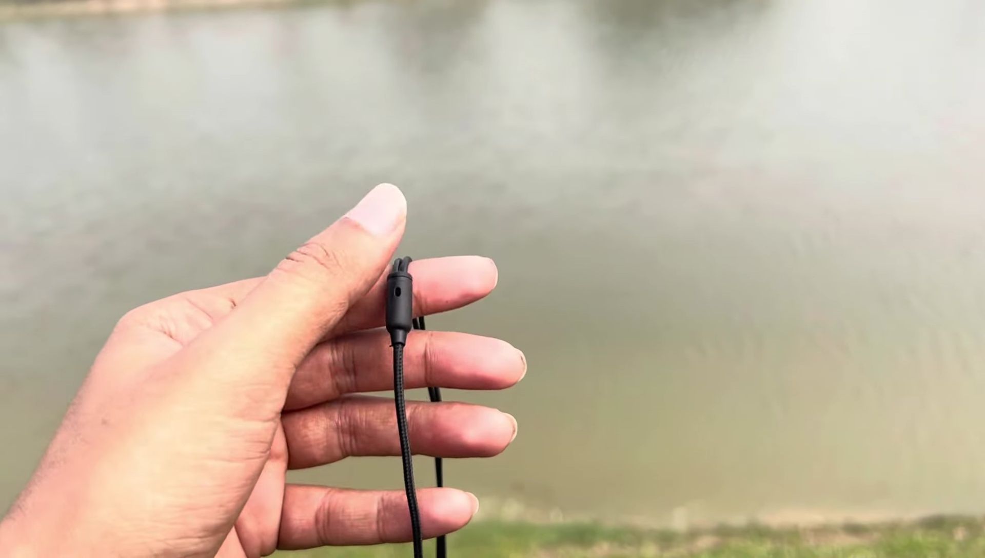 Close-up of the thin earphone wires