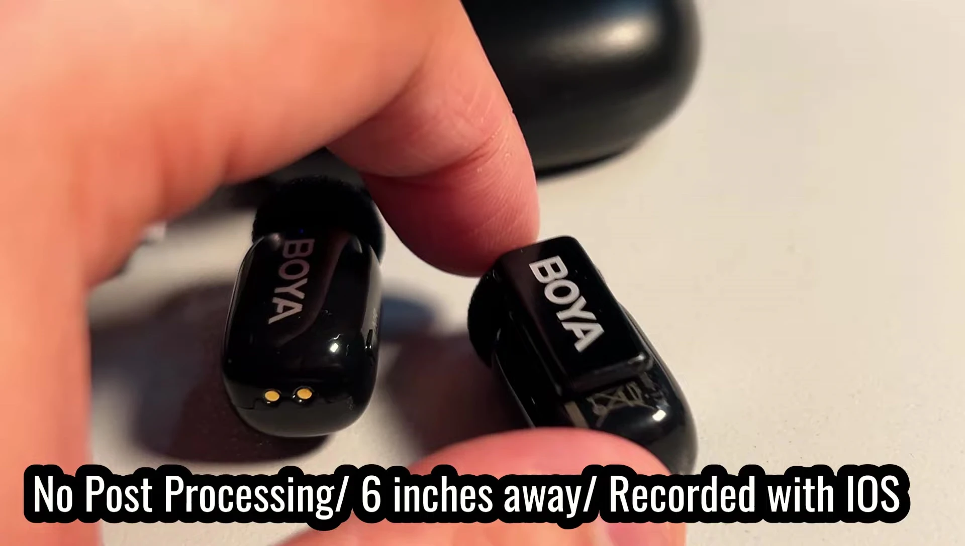 Close-up of the microphone with foam wind cover and small clip