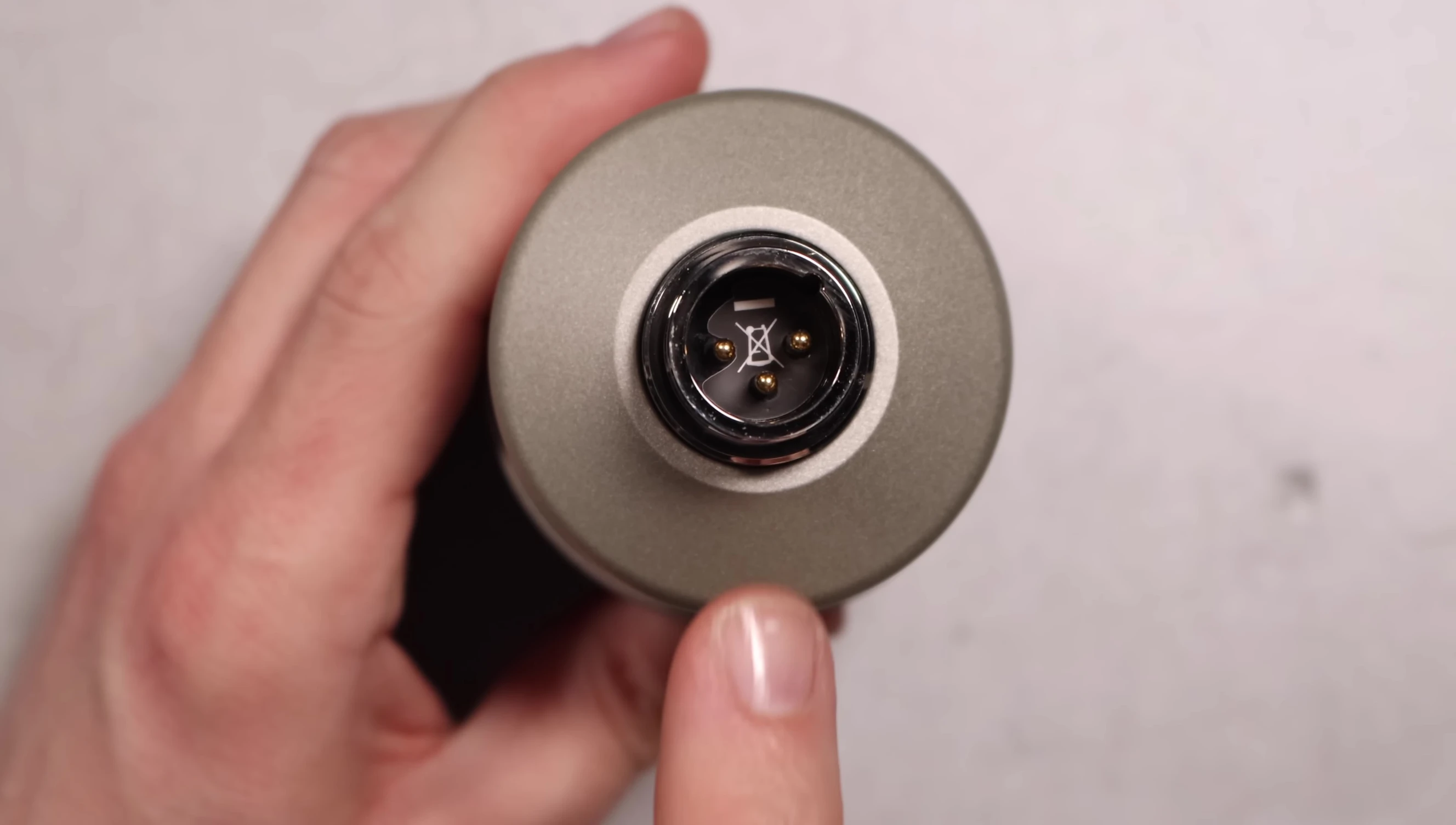 The bottom of the microphone showcasing the XLR port.