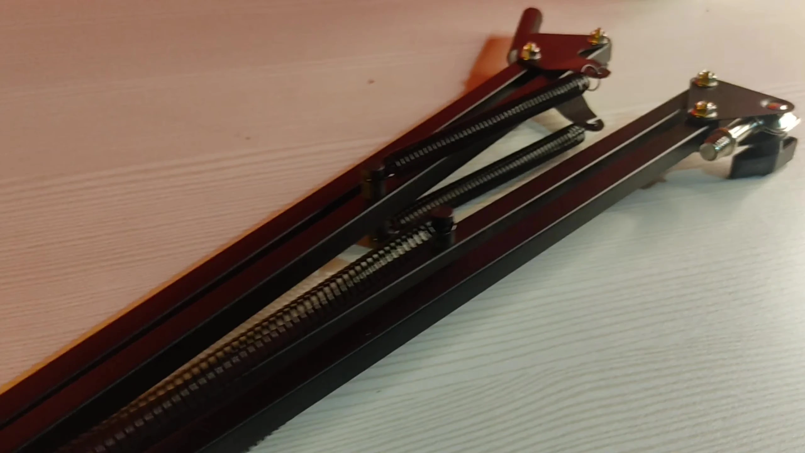 Attaching the boom arm to the clip.