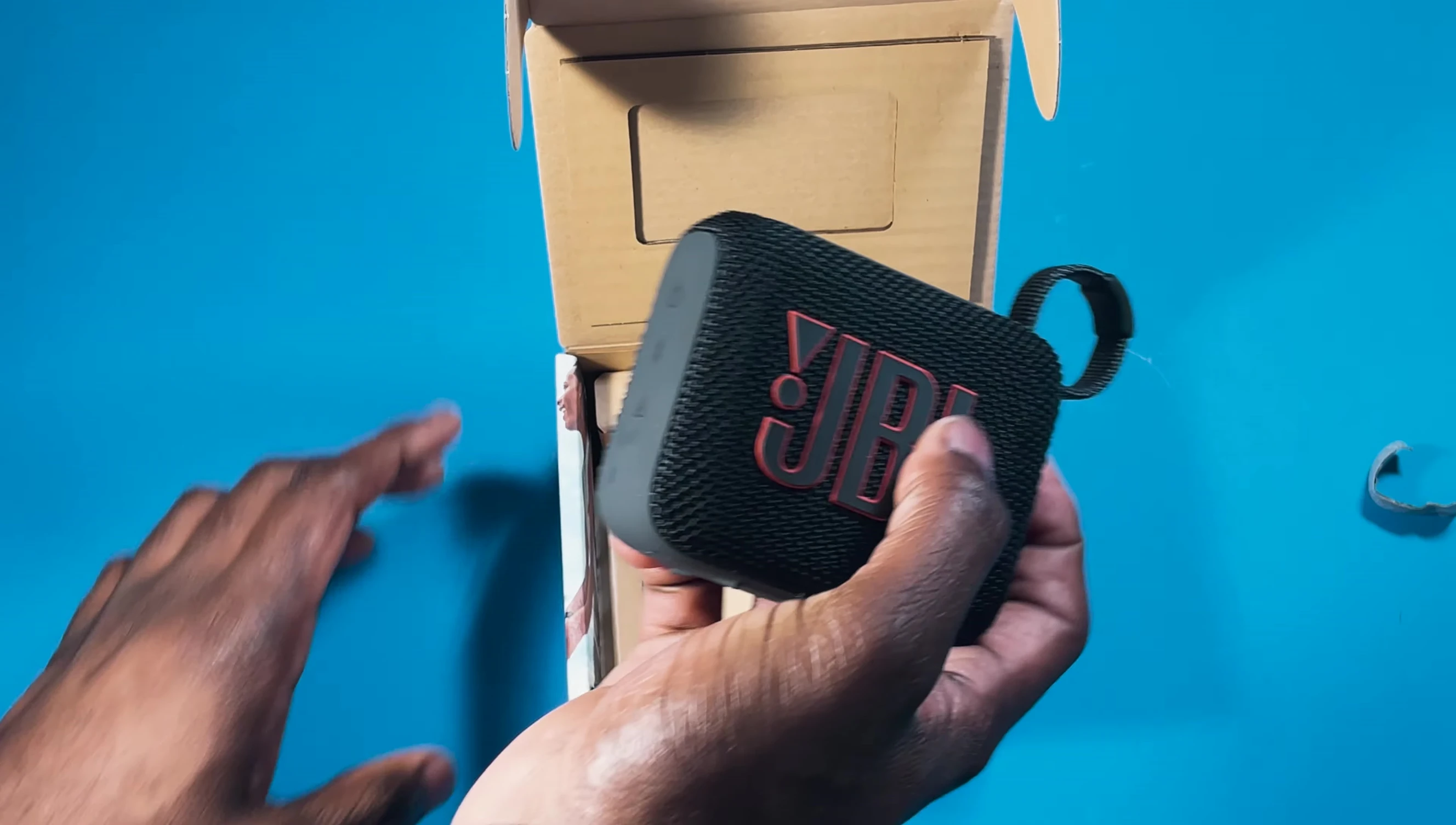 The JBL GO 4 speaker inside the box.
