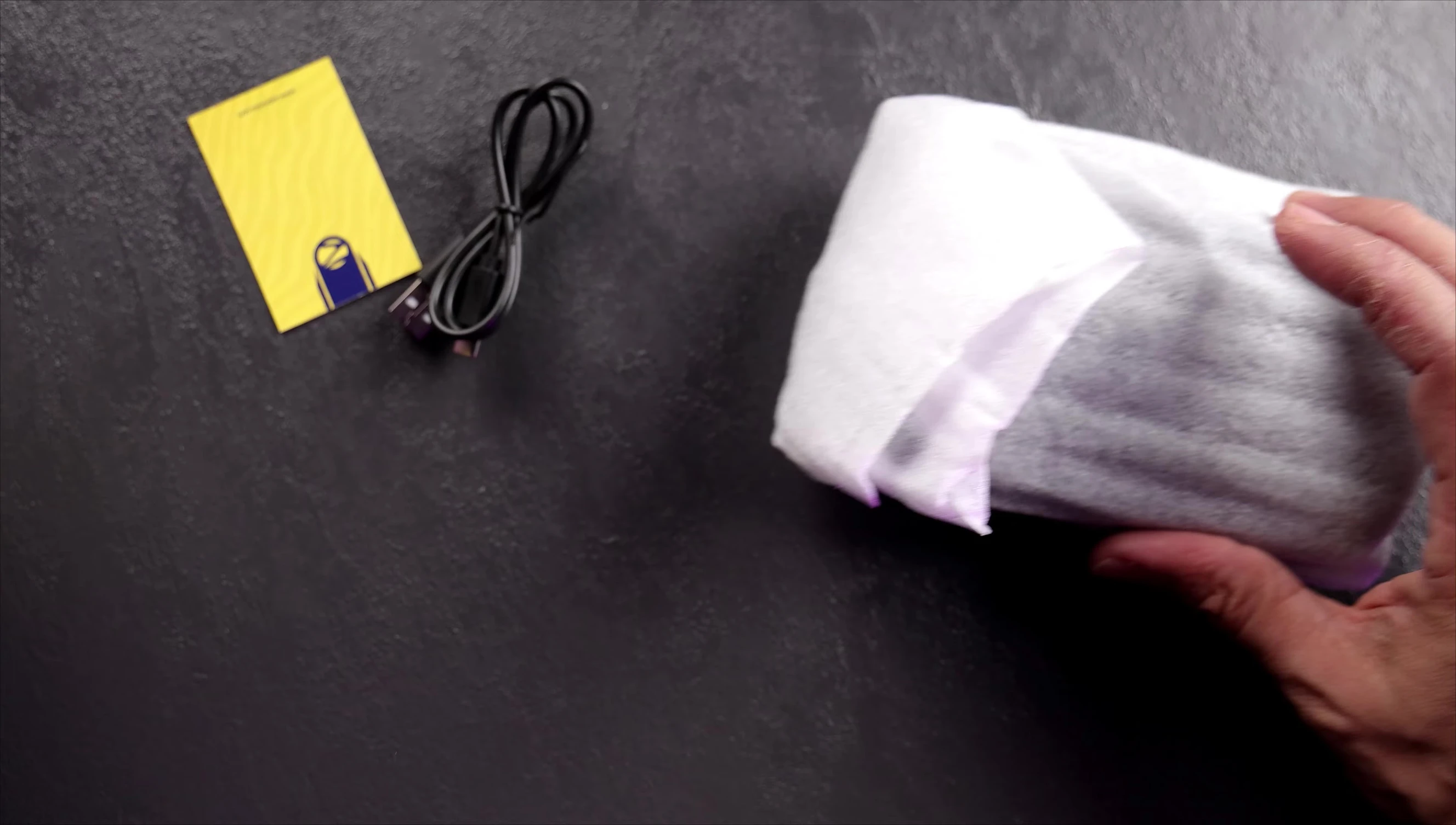 Close-up of the speaker packaging and included accessories.