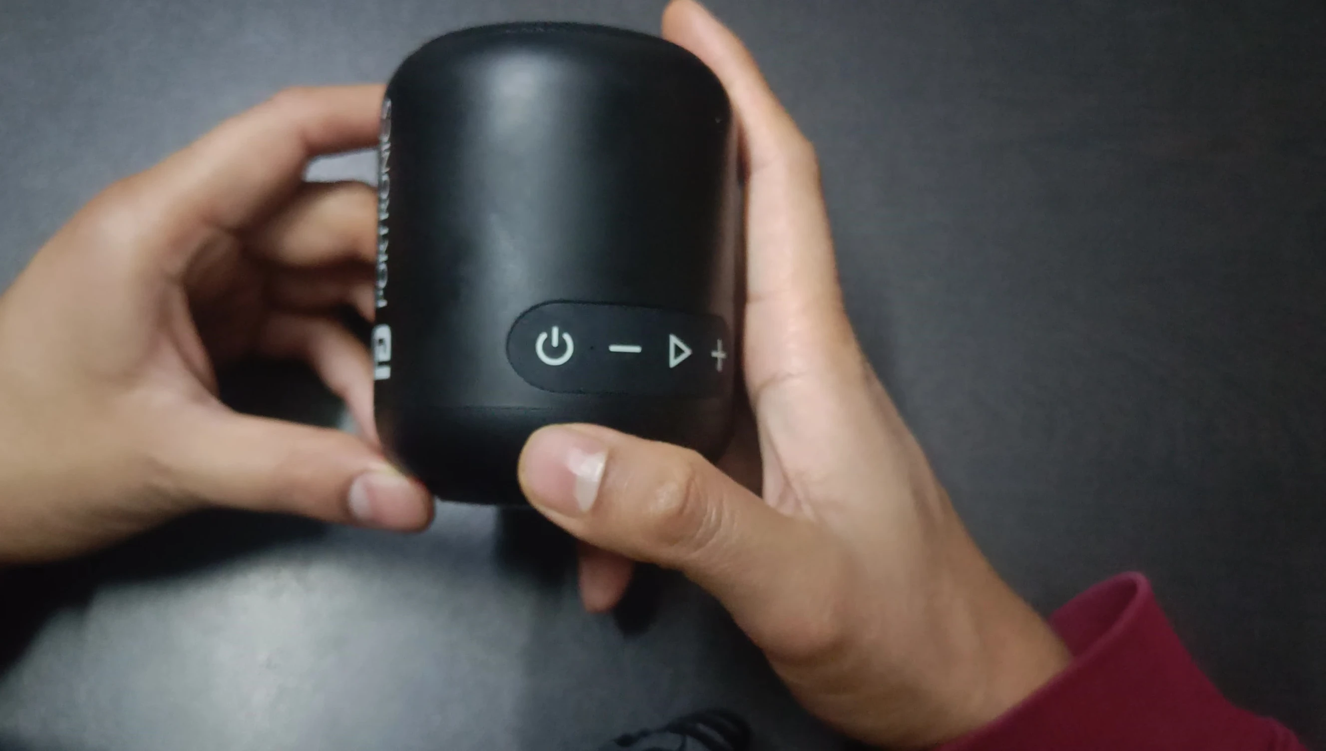 Close-up on the speaker's control buttons