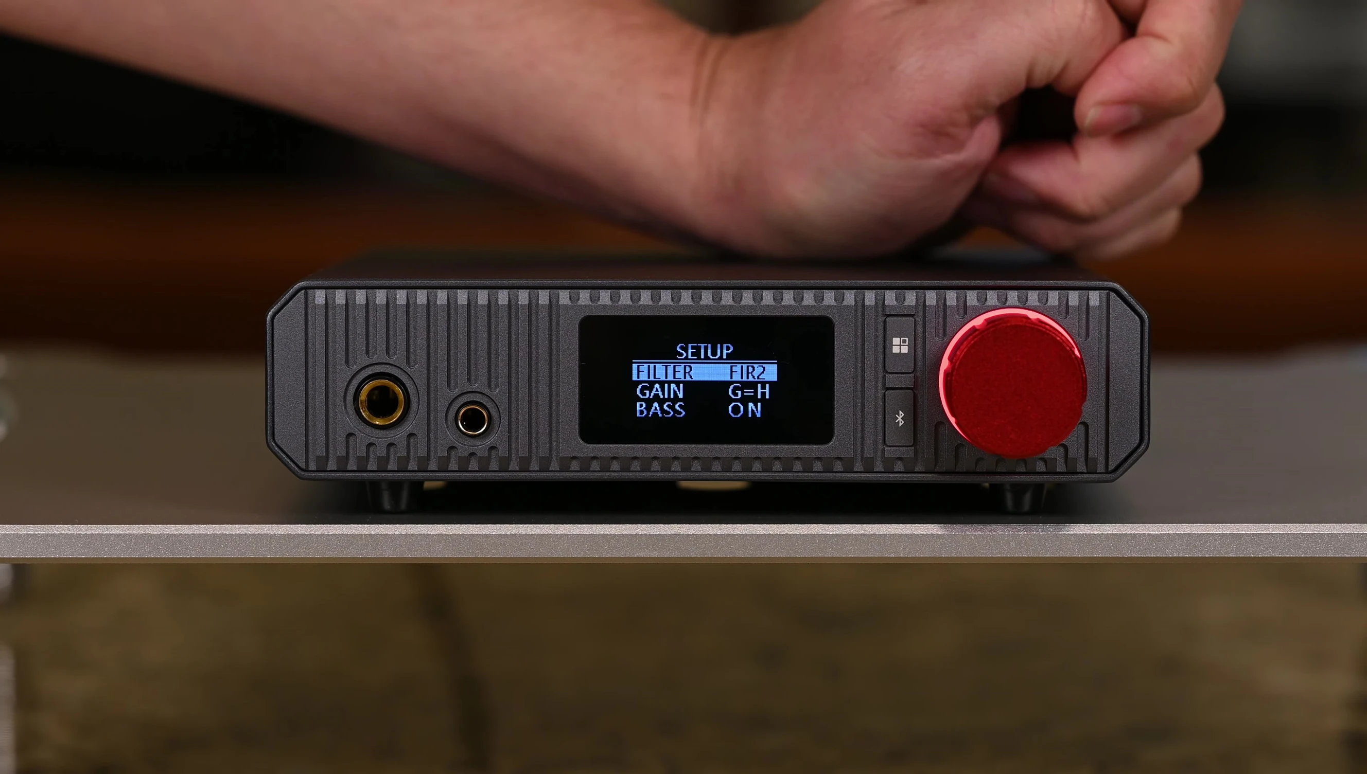 The OLED screen displaying the PCM filter selection menu.