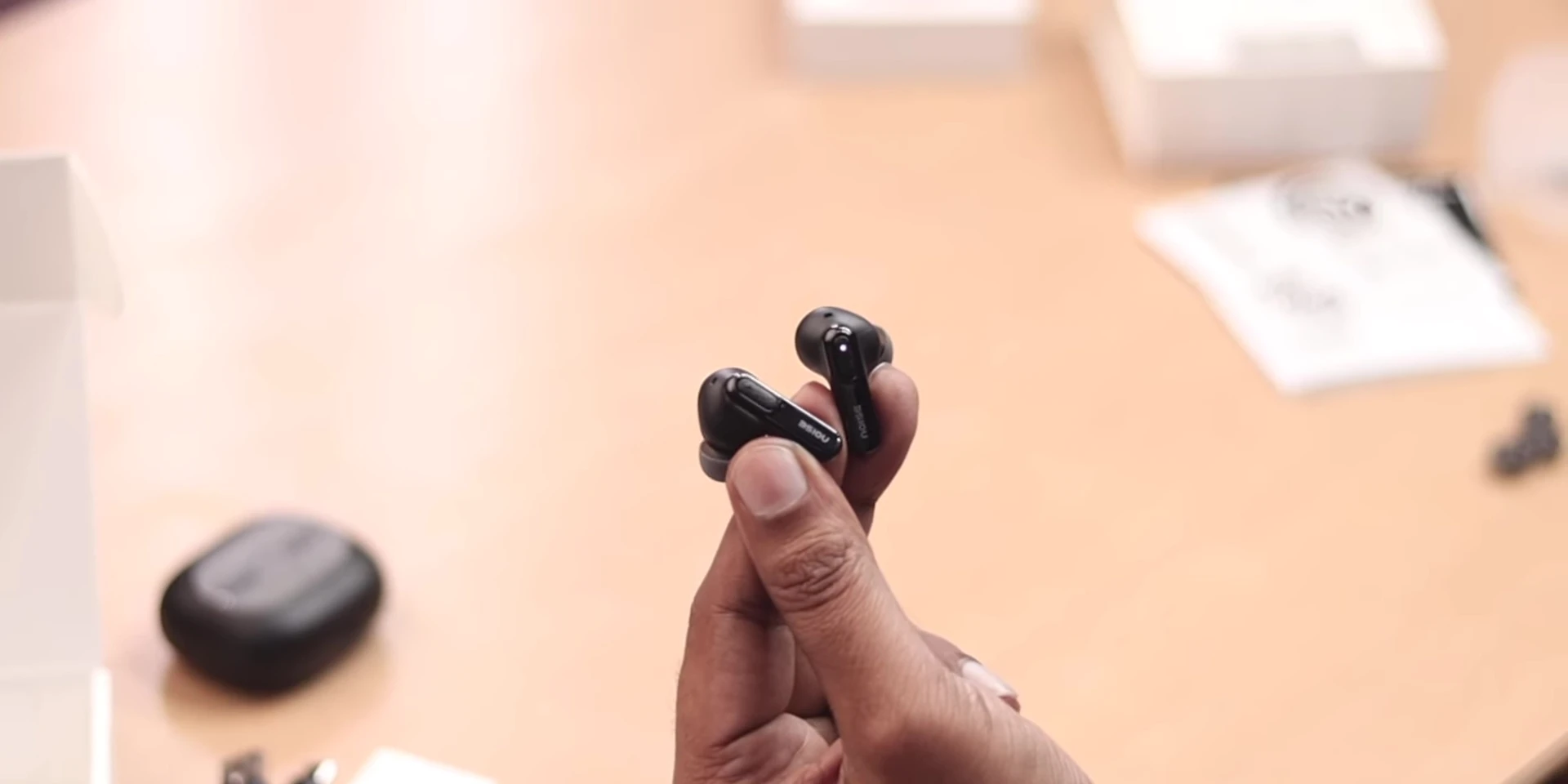 Illustration of touch controls on the earbuds.