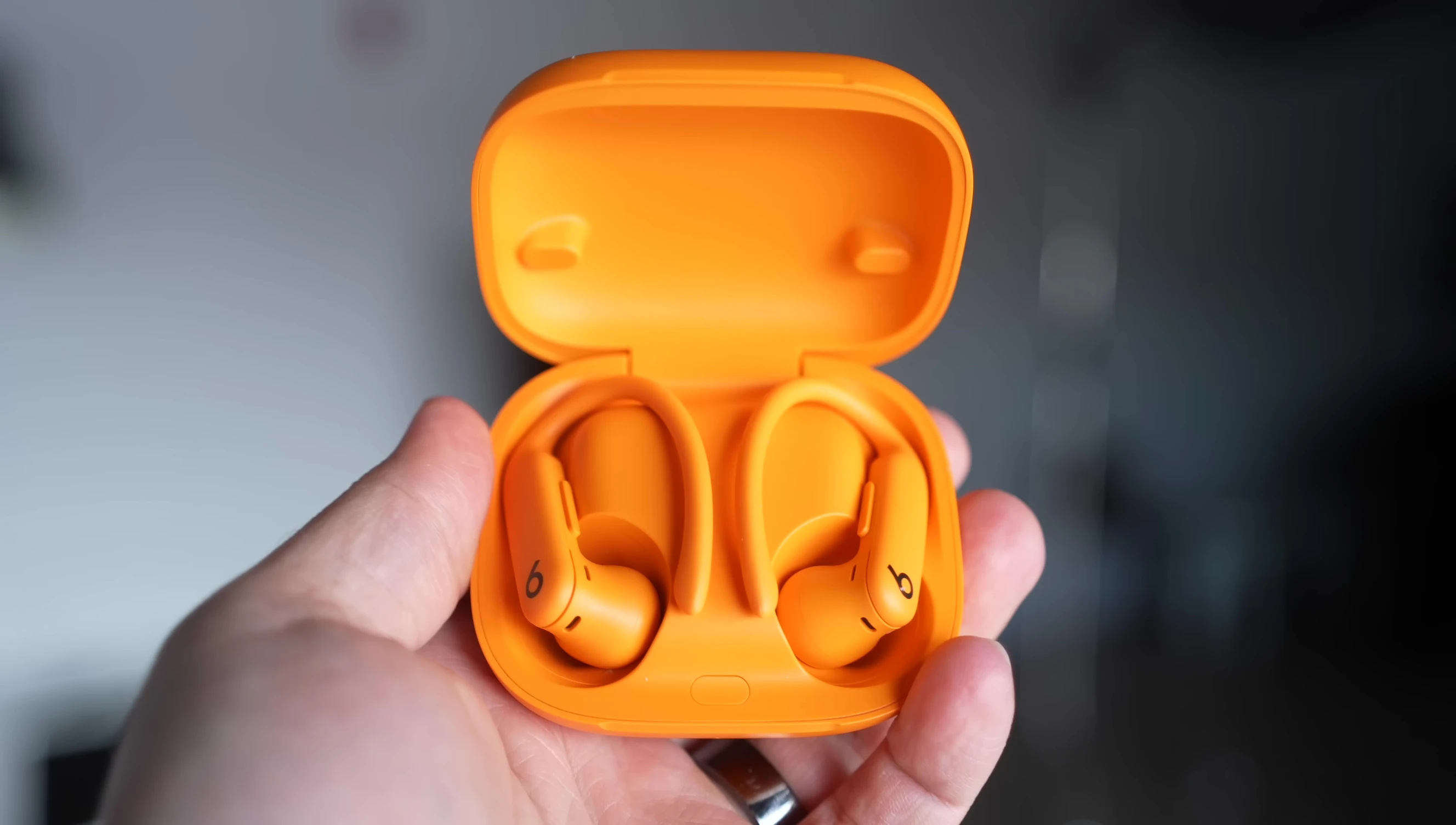 Close-up of the Powerbeats Pro 2 earbuds highlighting the heart rate sensor location