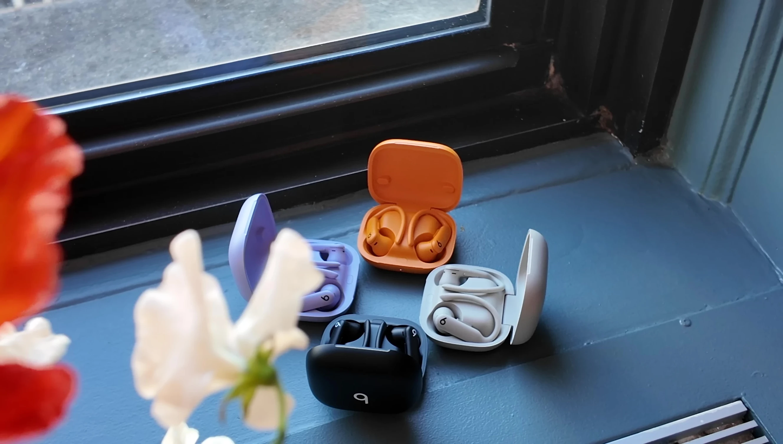 Close-up shot of the earbud highlighting the Beats logo button.