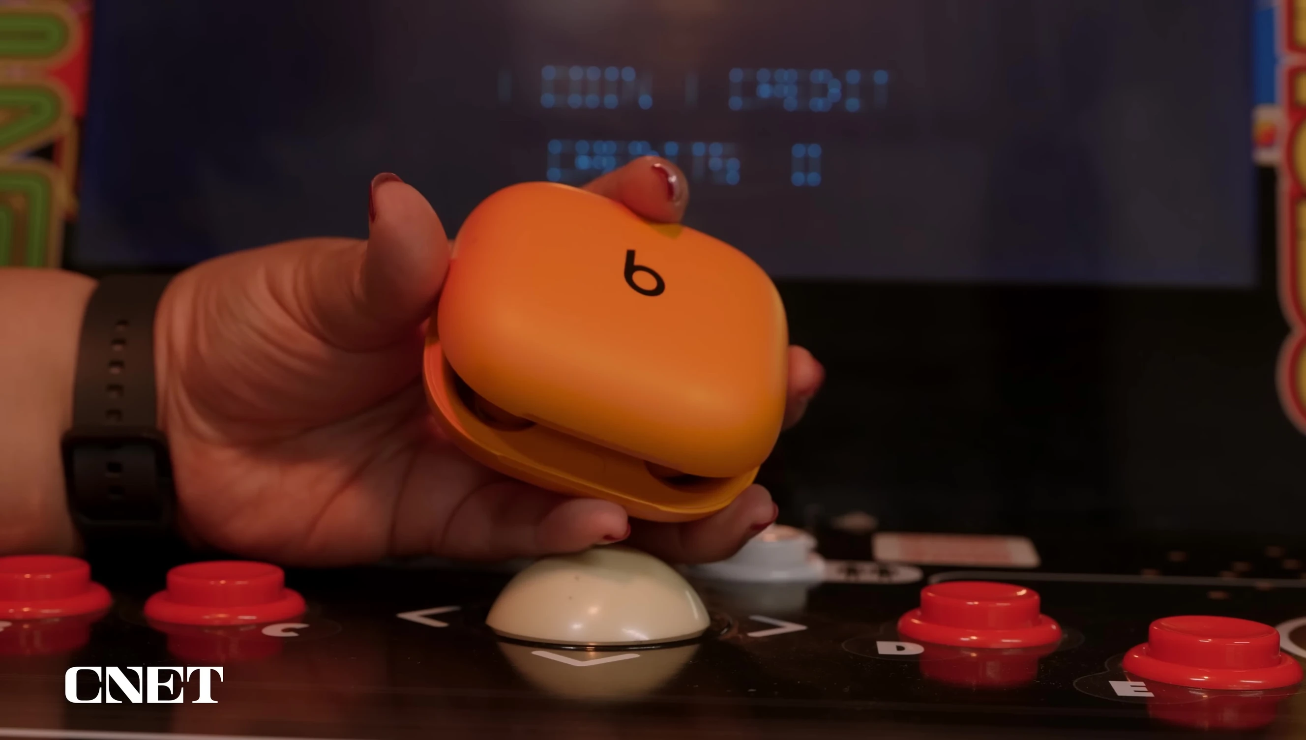 The smaller charging case of the Powerbeats Pro 2.