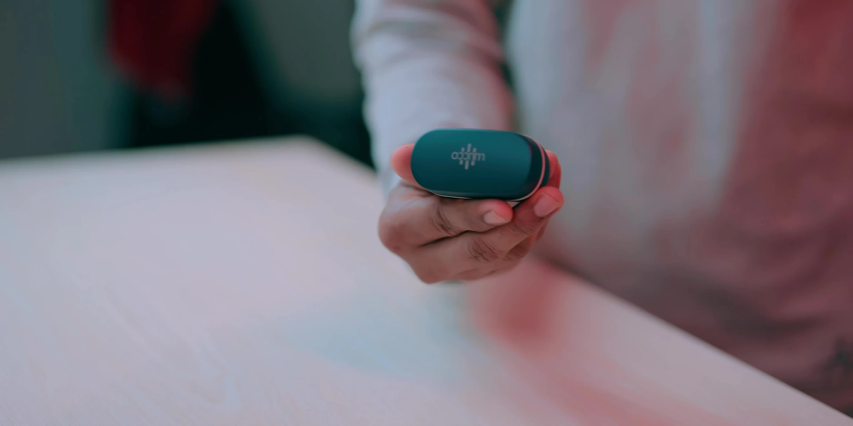 The microphone showing the branding and indicator light
