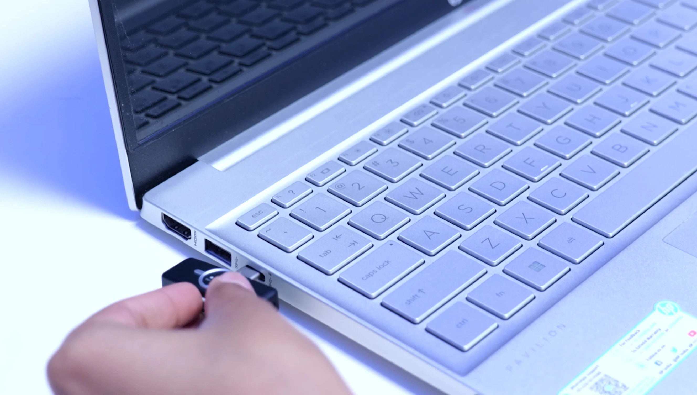 Demonstrating the USB-C connection to the laptop.