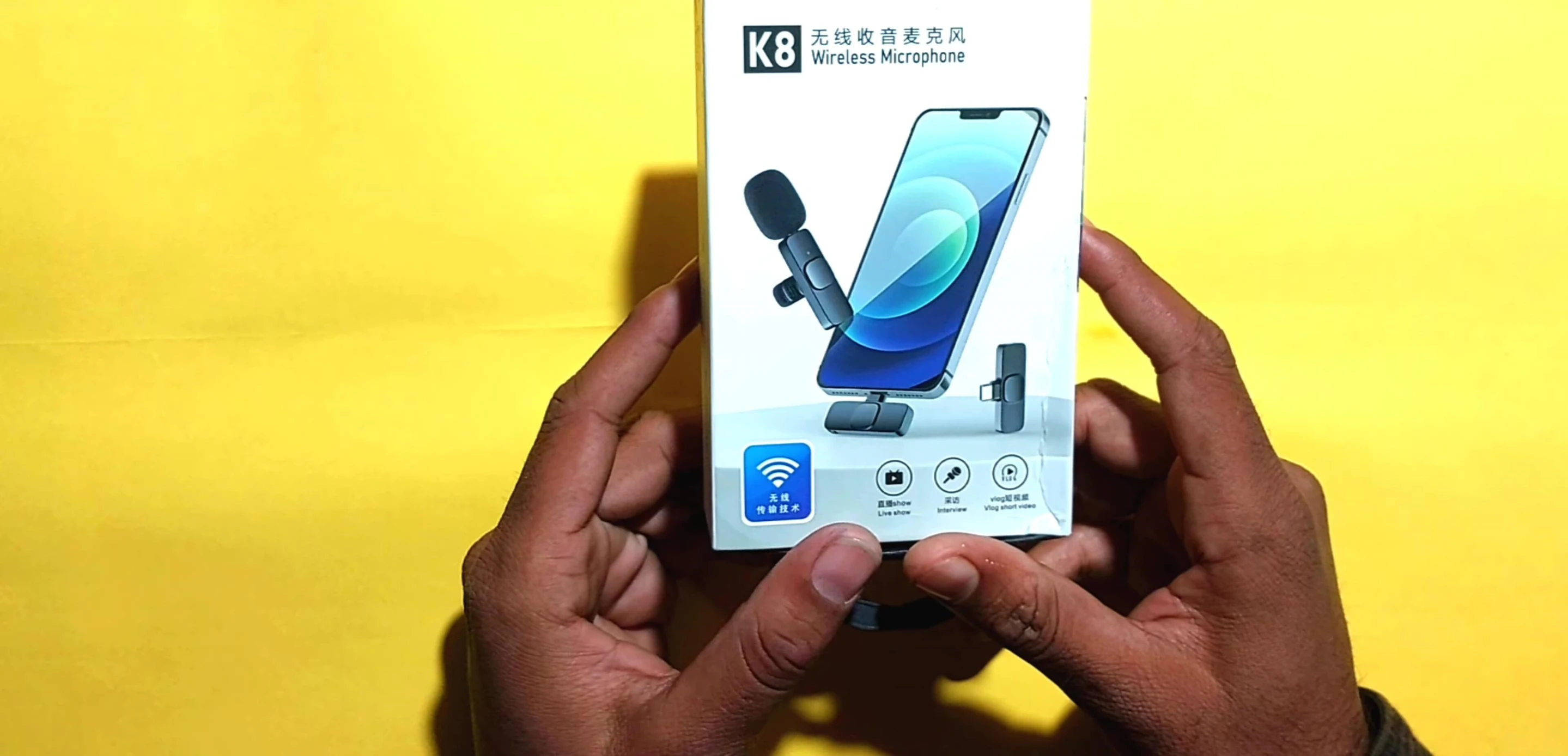 Close-up shot of the microphone box, highlighting key features.