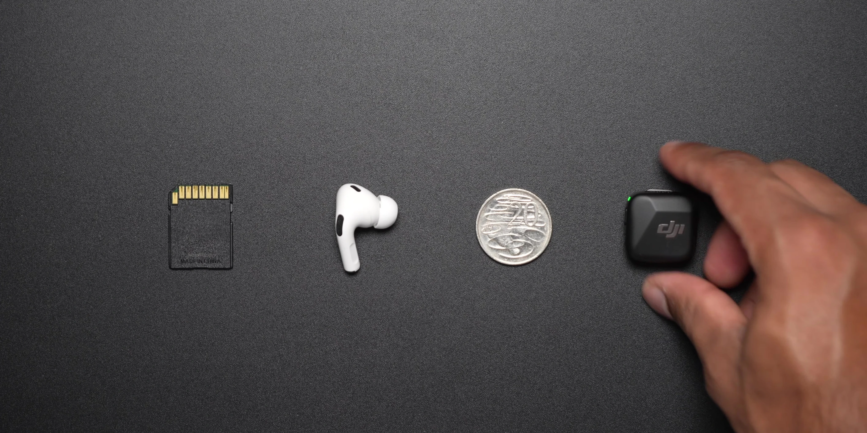 Close-up of the tiny DJI Mic Mini transmitter