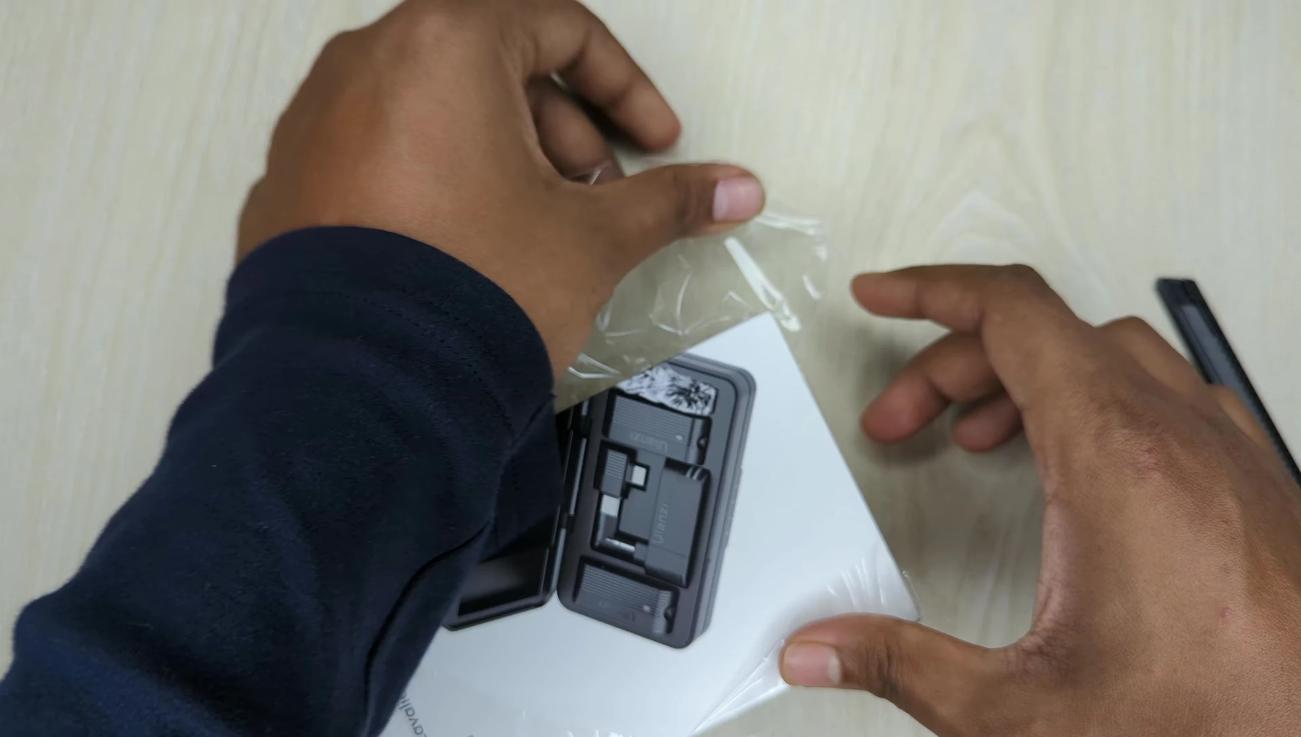 User manual and charging cable shown
