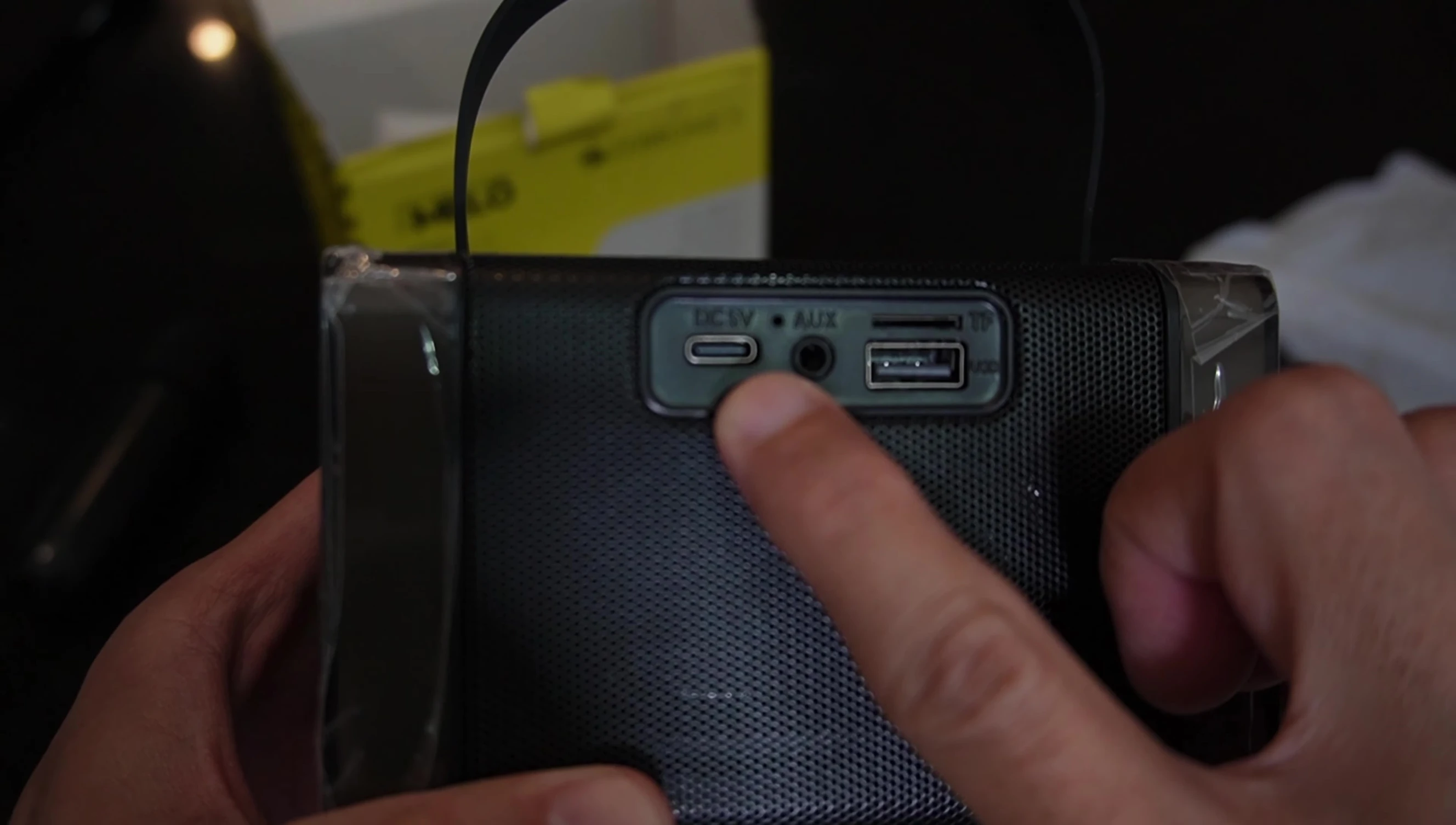 Rear panel showing the ports: USB-C, AUX, USB-A, and MicroSD