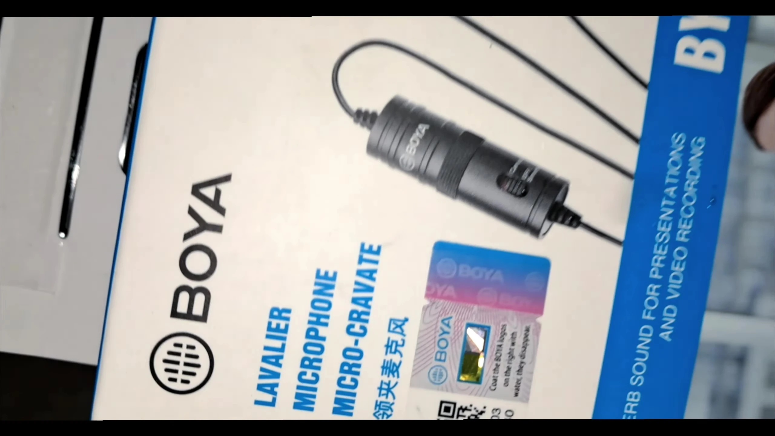 Close-up of the Boya logo on the microphone.