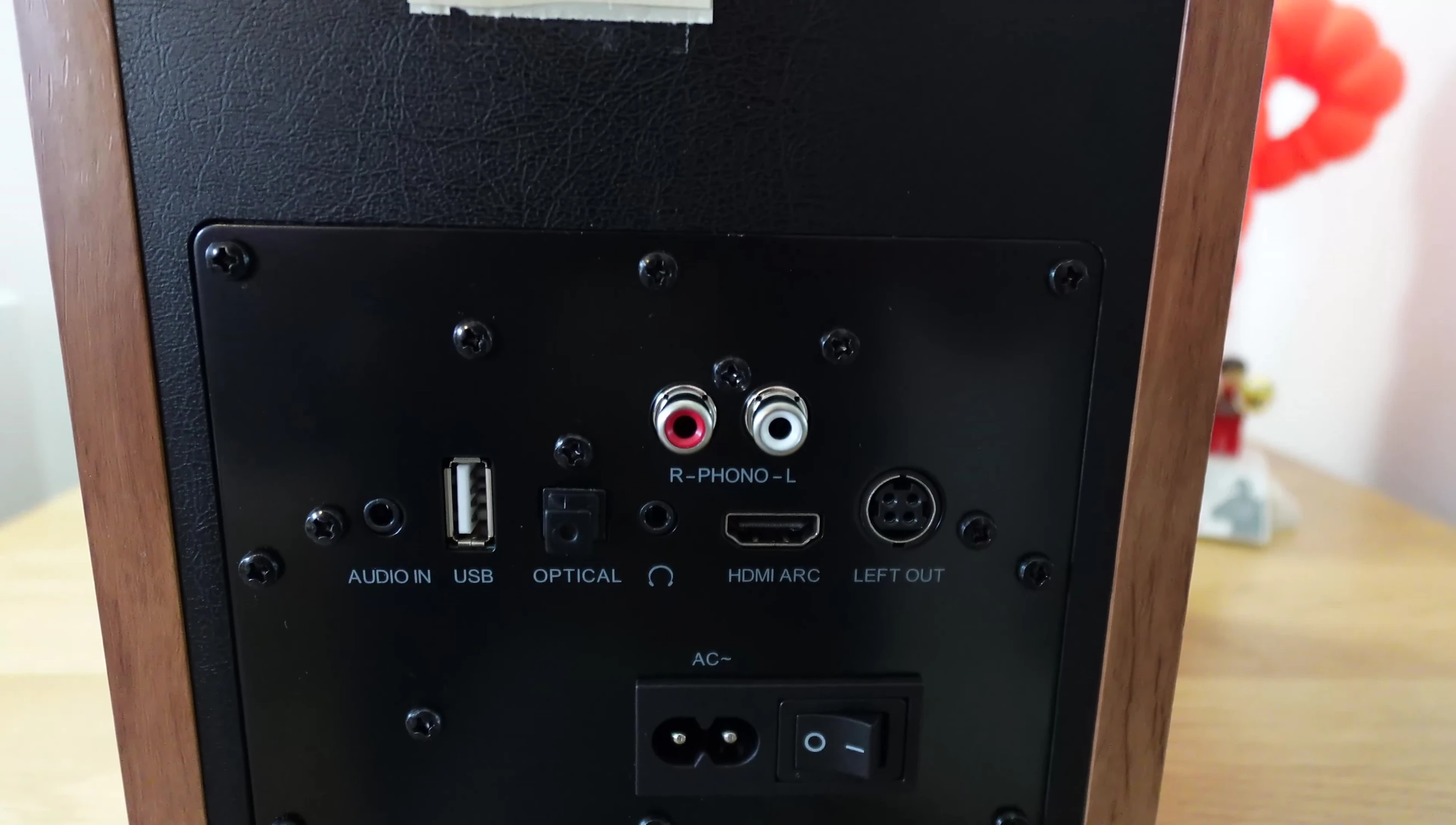 Majority D100 speakers positioned on a bookshelf.