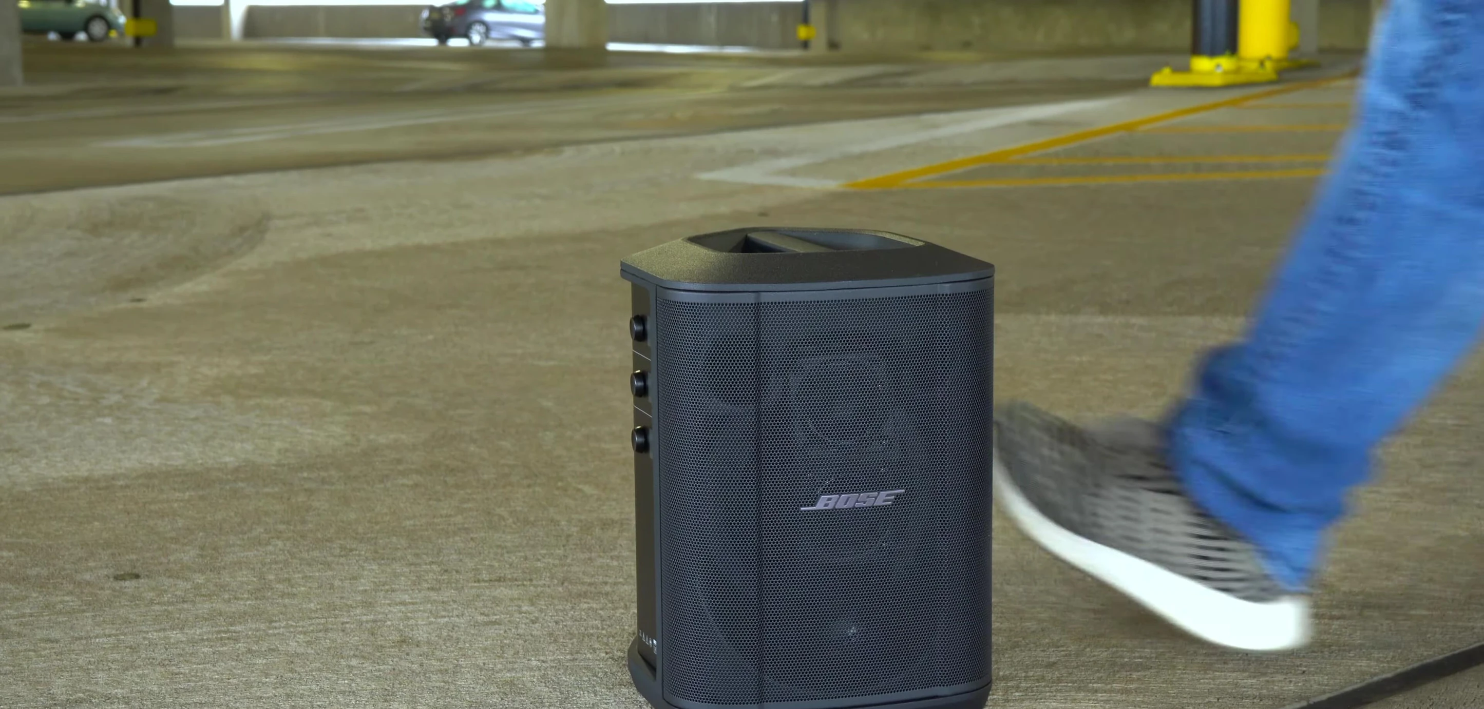 Close-up of the Bose S1 Pro+ speaker showcasing its compact size and carrying handle.