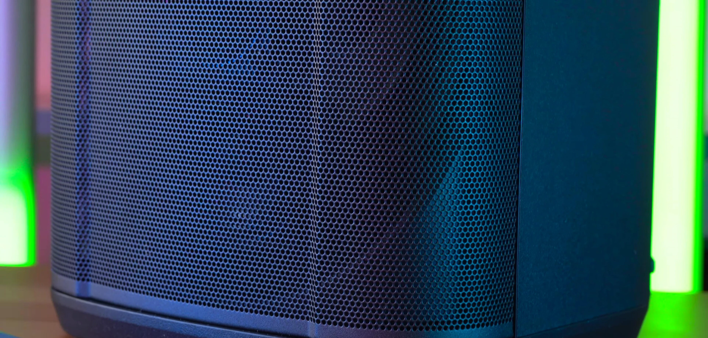 Image highlighting the speaker's thin grill and exposed ports, emphasizing potential fragility and water vulnerability.