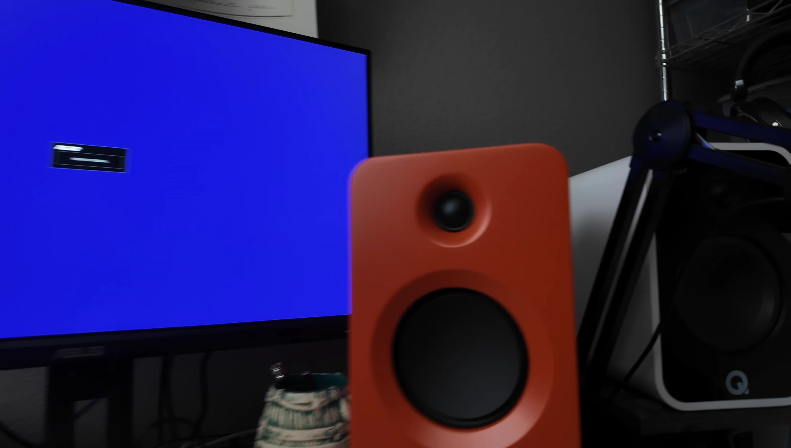 The speaker displayed on a desk setup