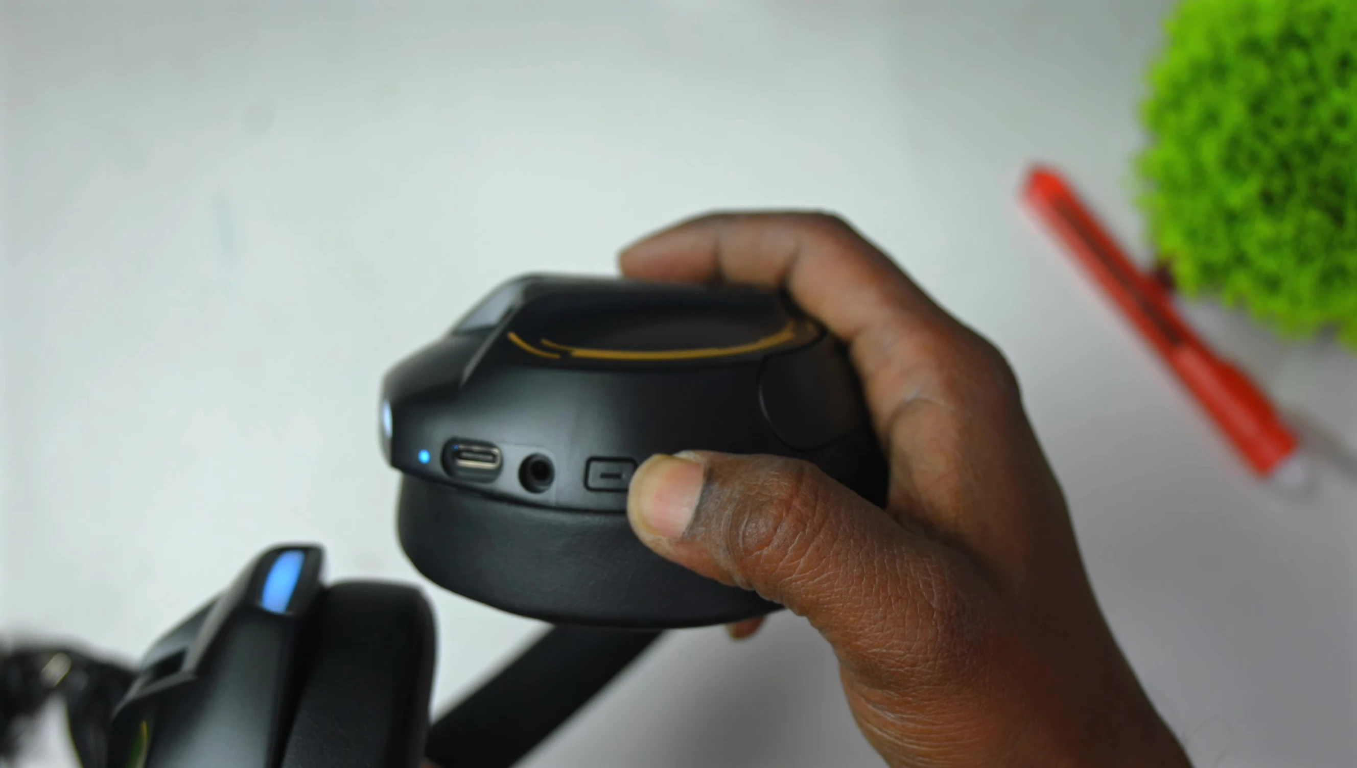 Headphones switched on, displaying LED light