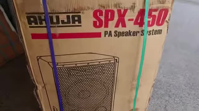 The AHUJA SPX 450 speaker box with specifications visible.