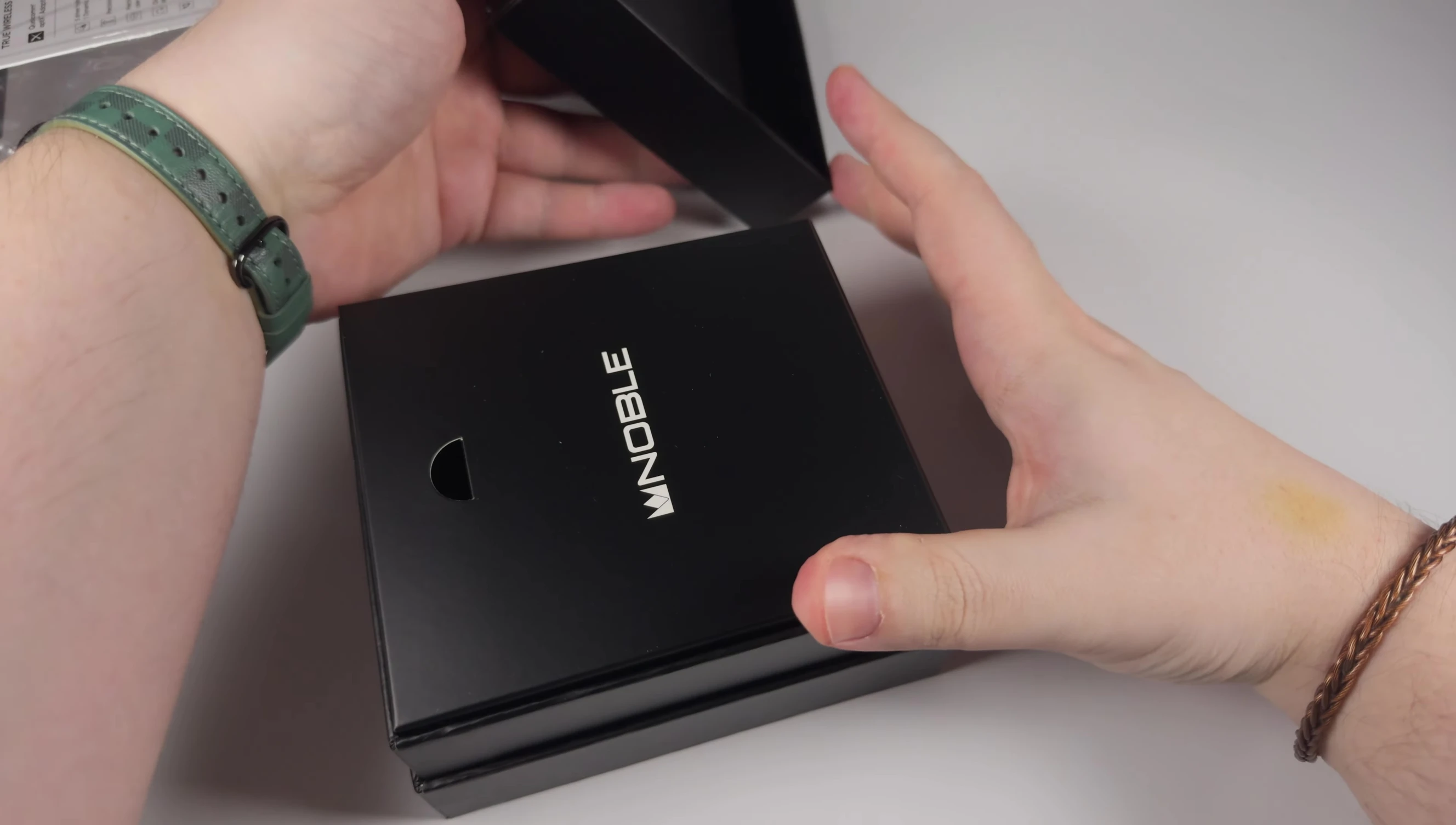 Earphones and accessories inside the box.