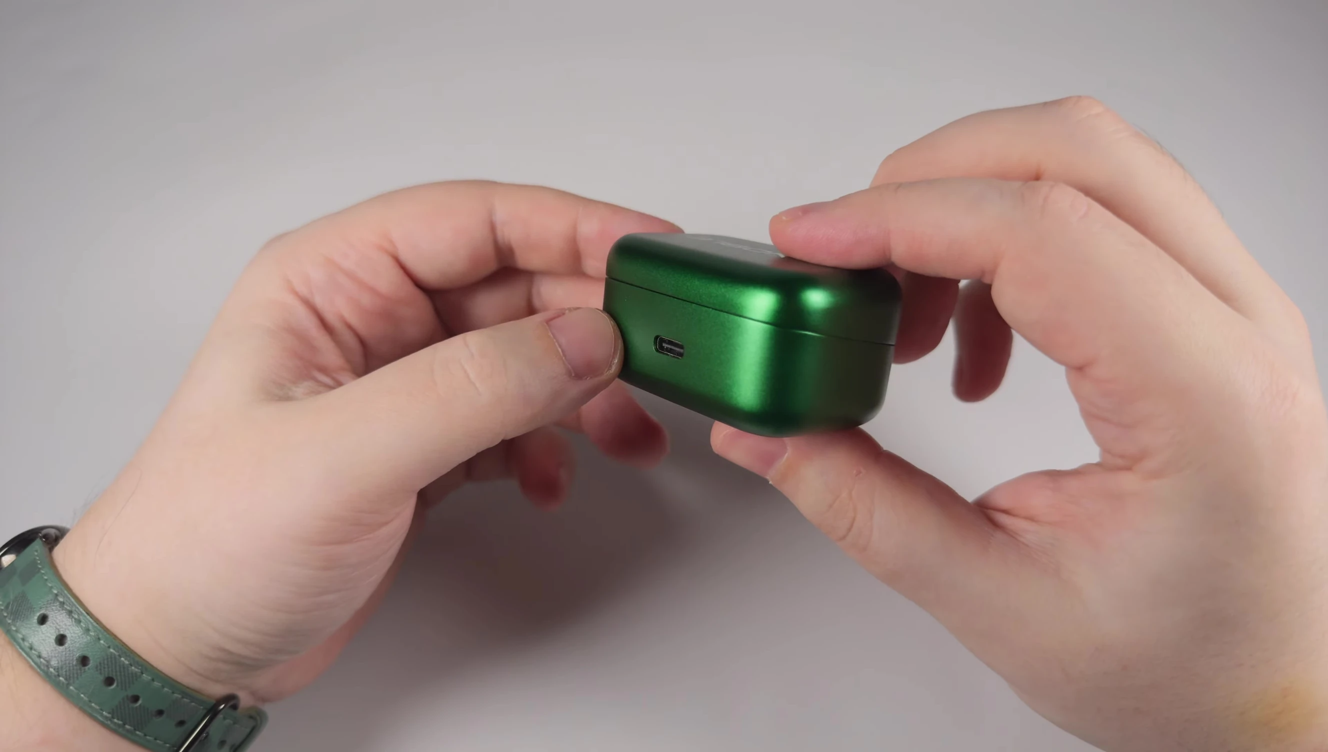 The charging case opening.