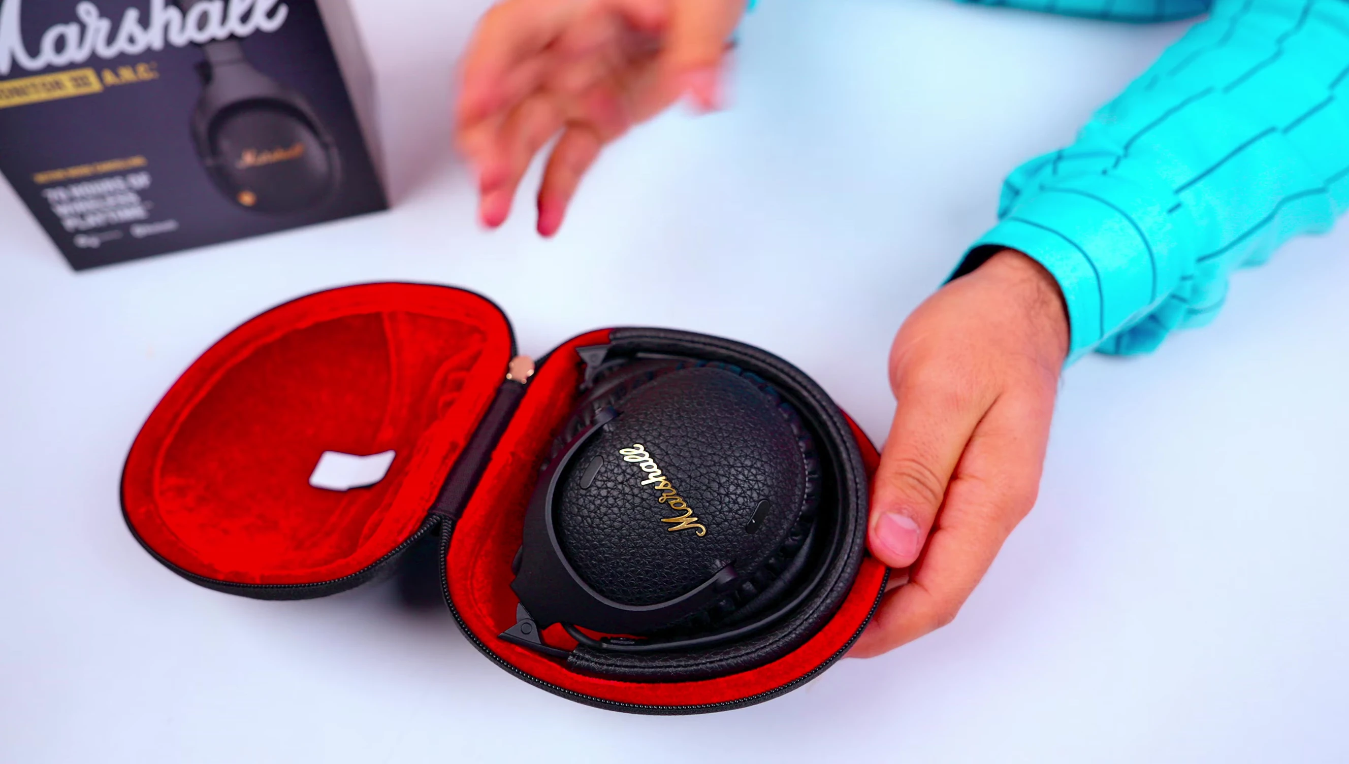 Opening the box to reveal the headphones