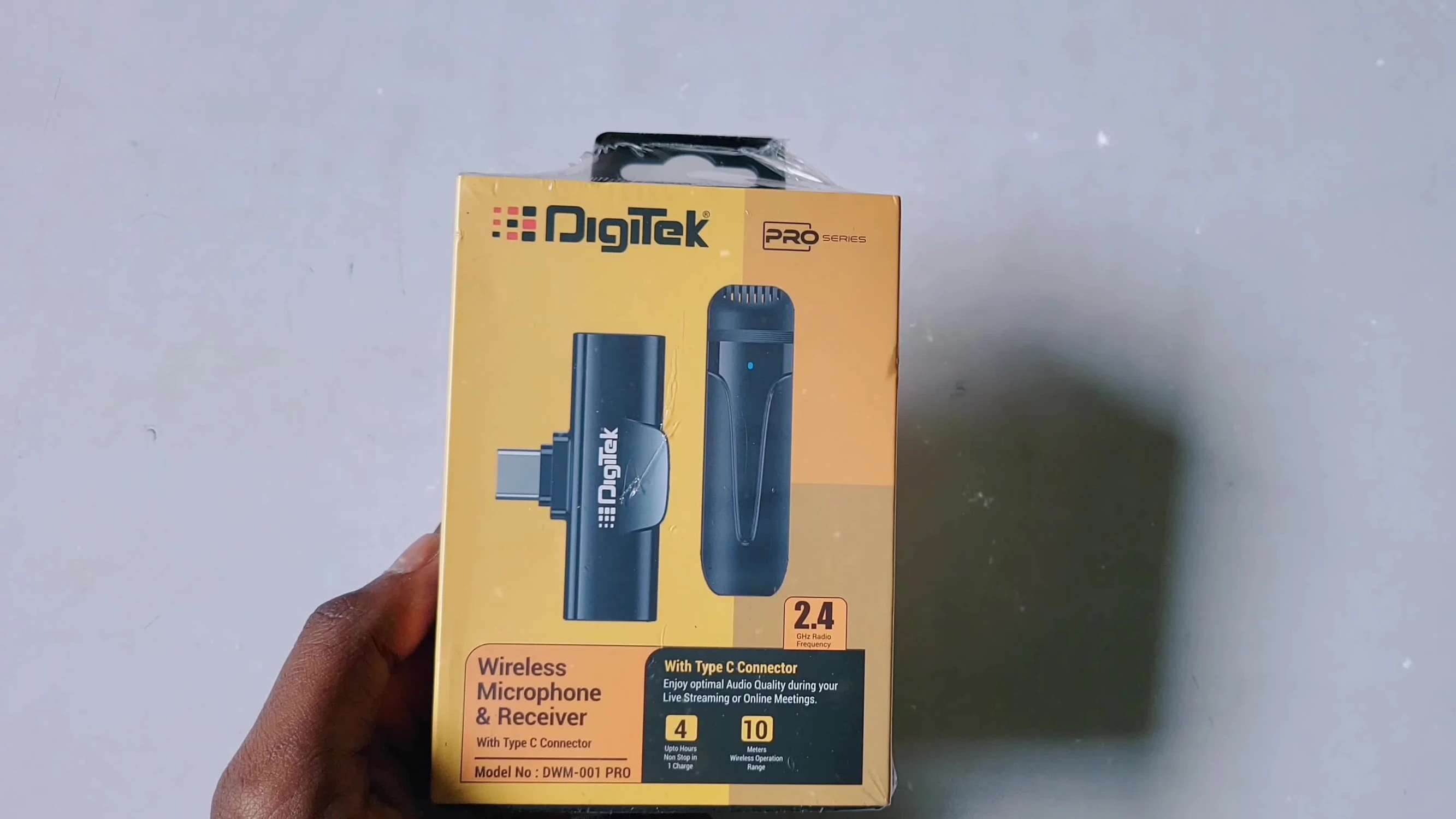The Digitek DWM 001 wireless microphone in its packaging.