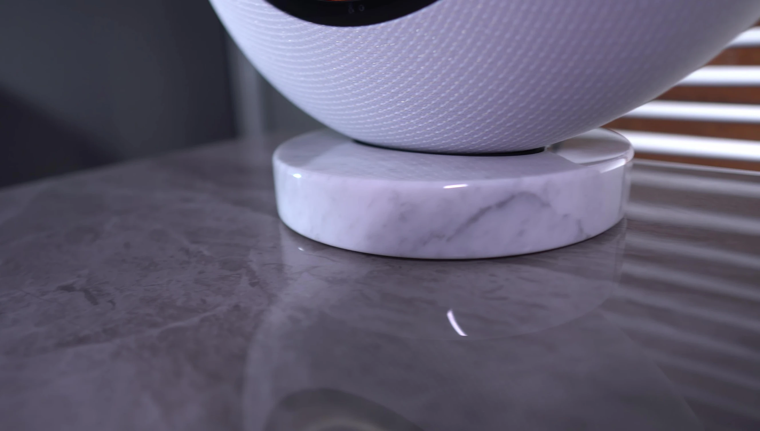 The speaker showing off its solid marble base.