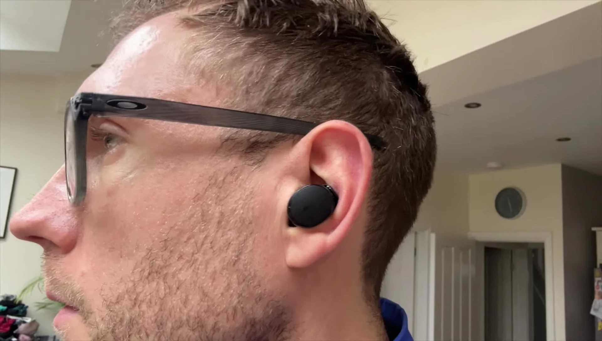 Earbuds in ear, showing secure fit