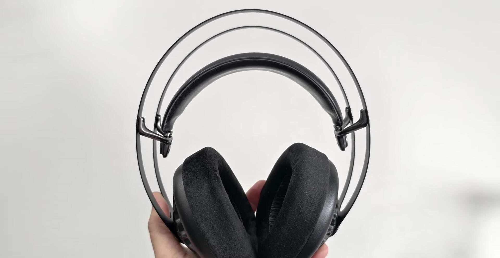 Headphone shown on the reviewer's head, highlighting the fit and comfort