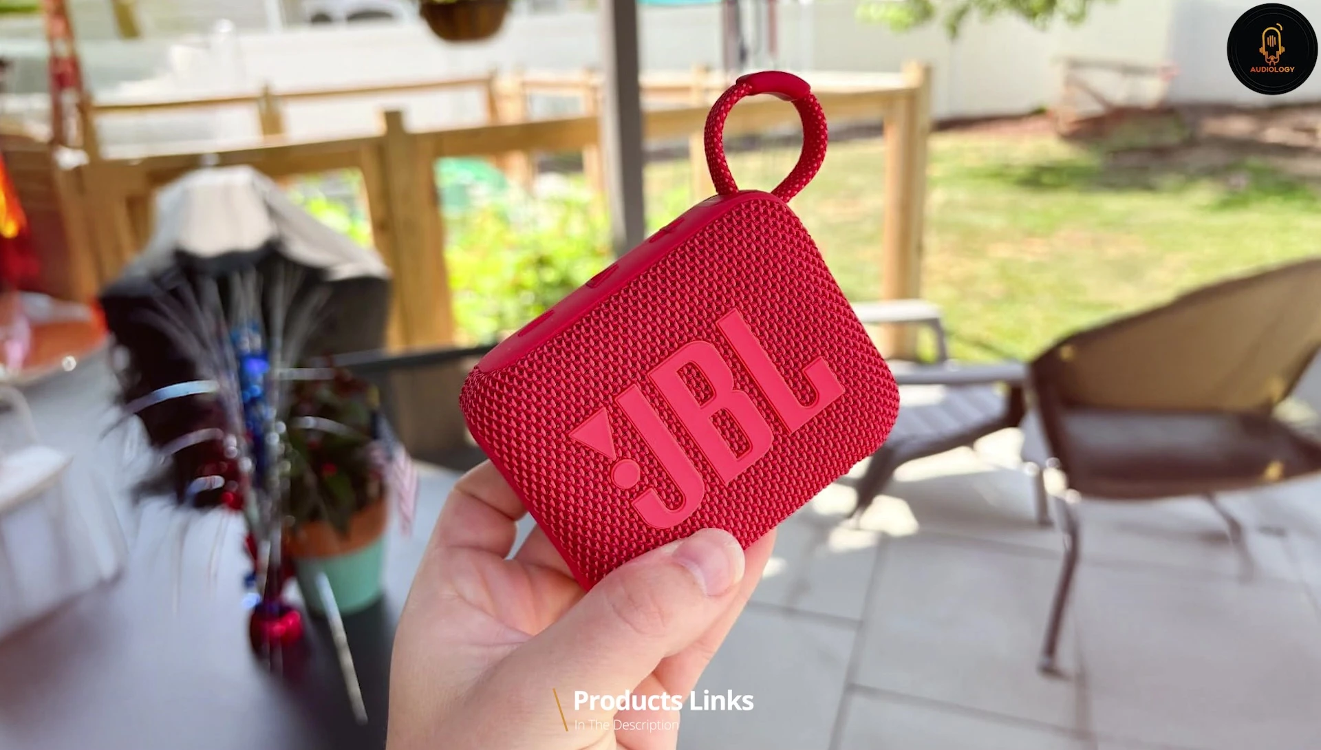 Close-up of the JBL Go 4 controls and fabric exterior