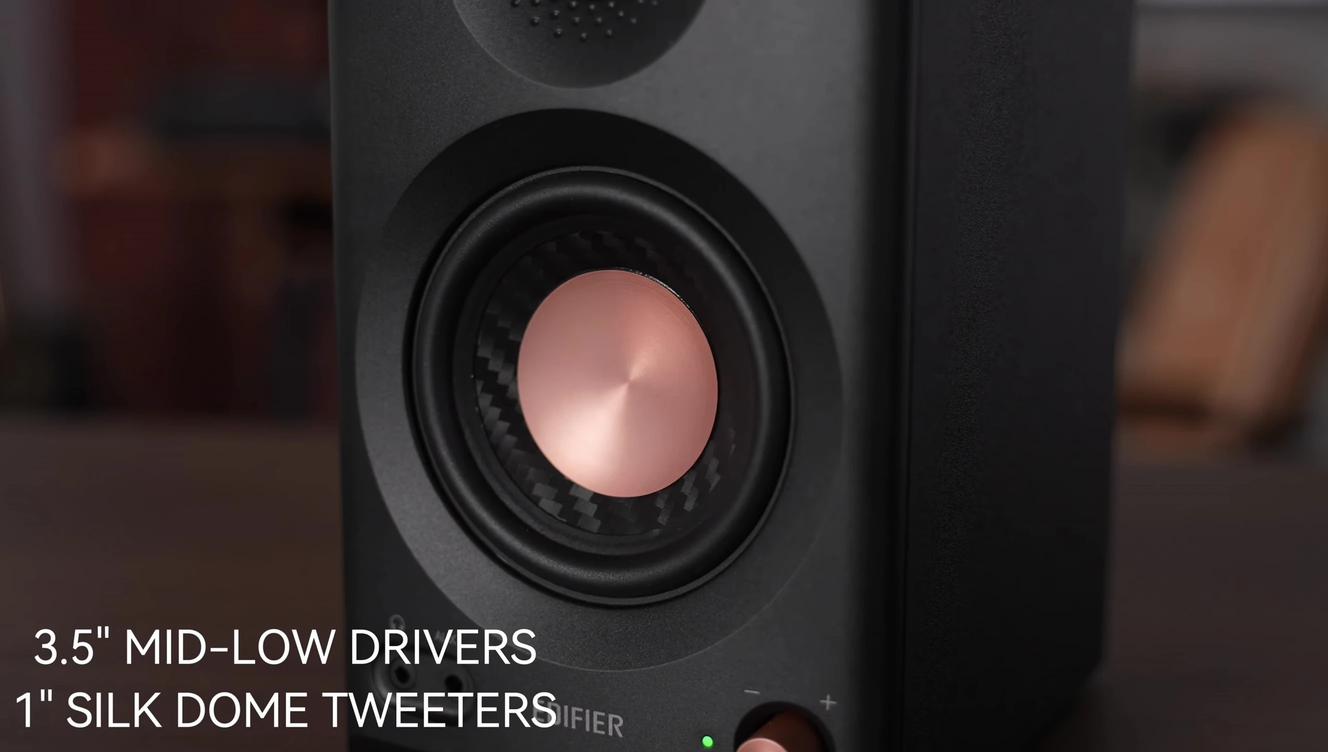 Close-up of the speaker showing the tweeter and mid-low driver.
